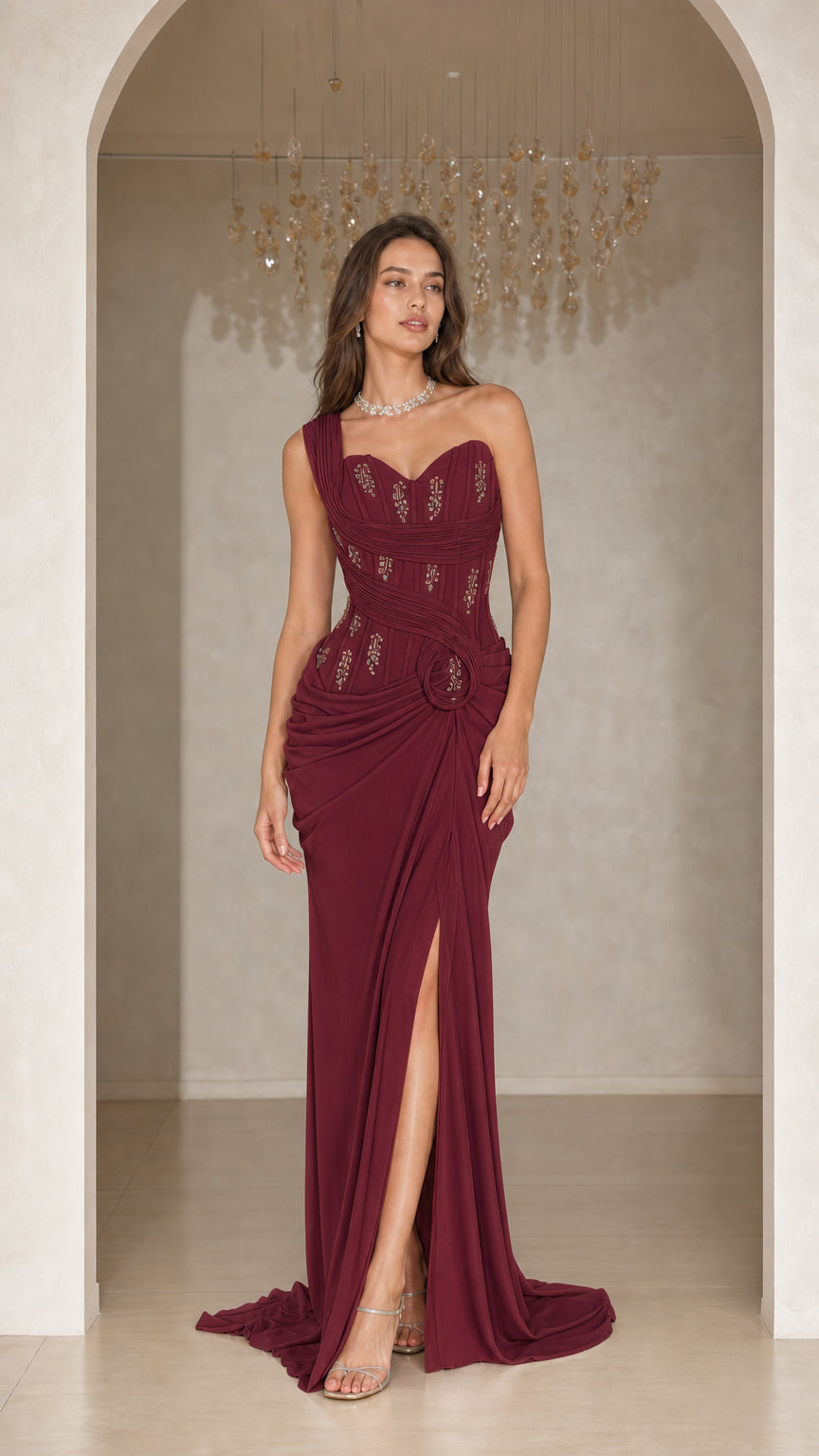 Woman wearing burgundy wine one-shoulder beaded evening dress