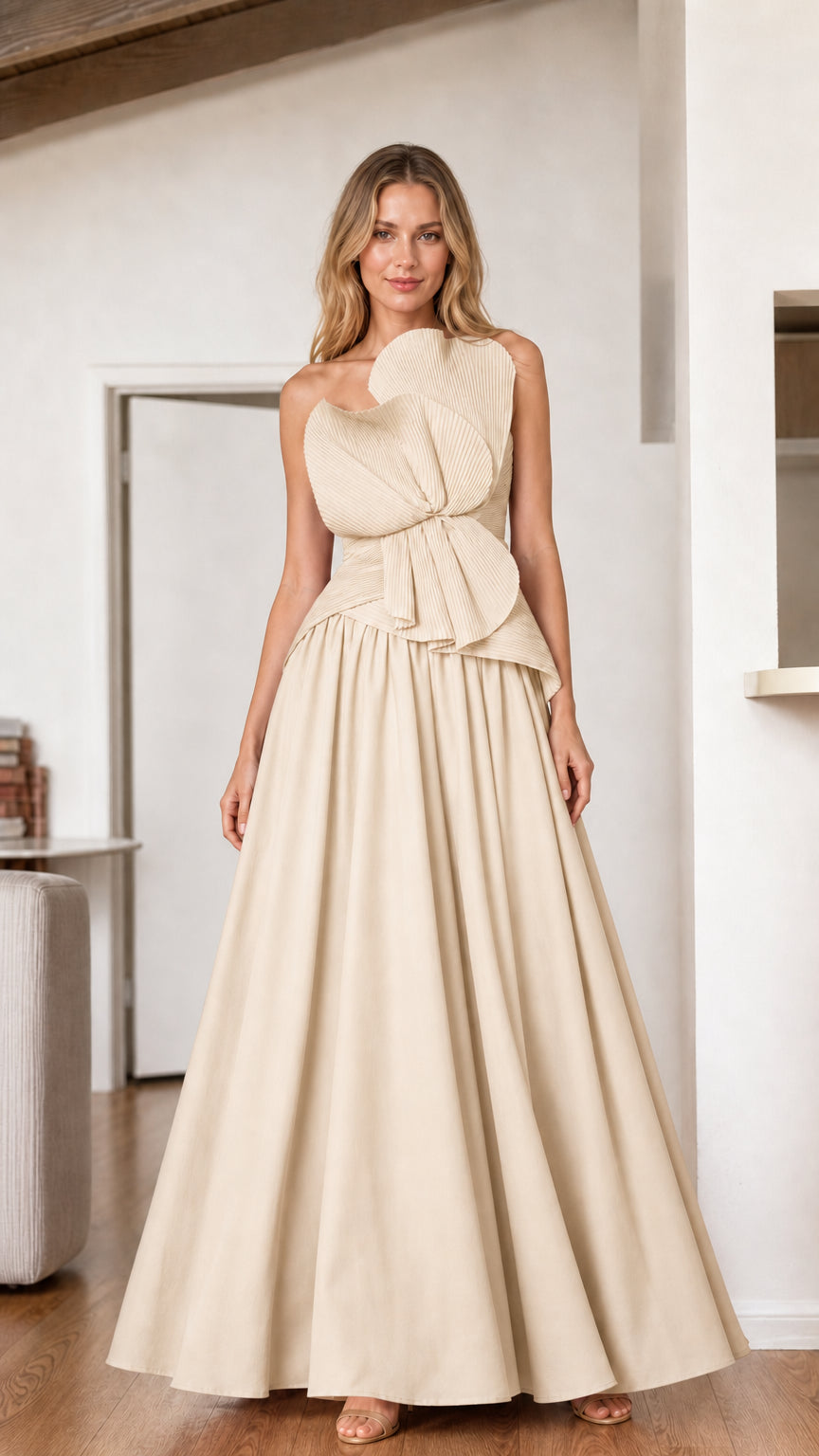 Champagne strapless pleated bodice formal gown with sweeping A-line skirt
