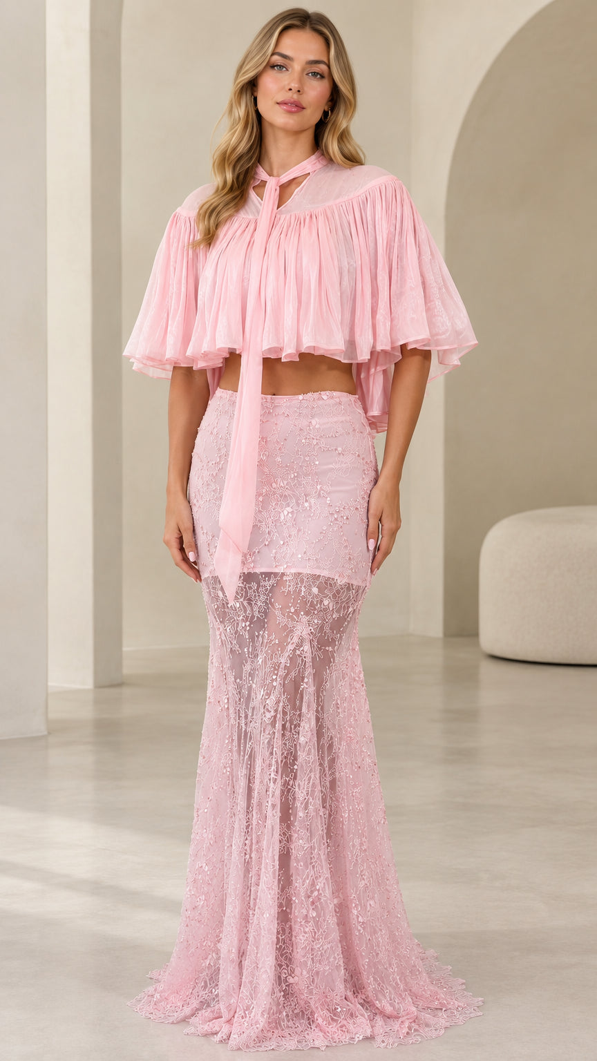 Front view of model wearing pink two-piece sequin lace maxi dress with pleated capelet
