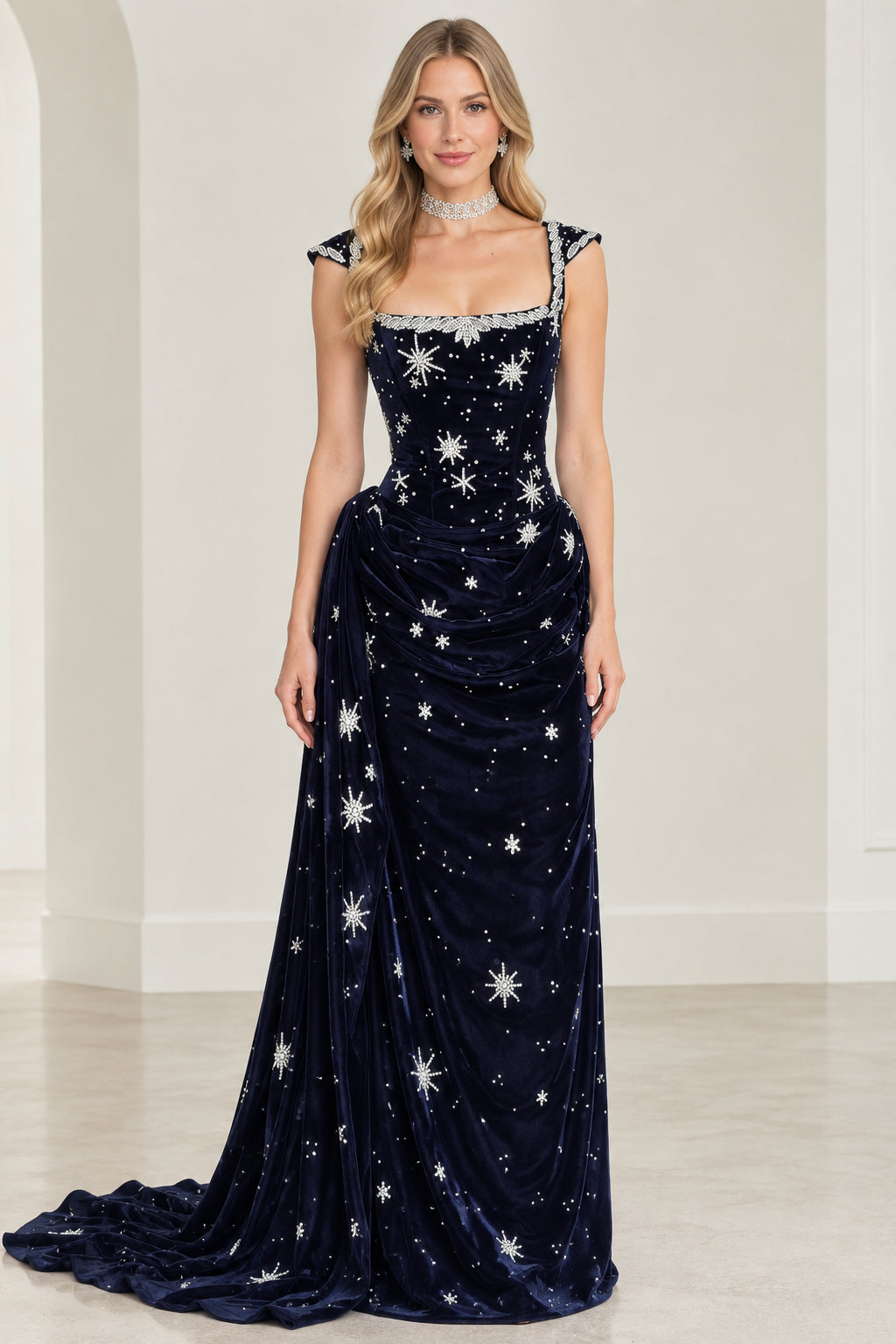 Front view of woman wearing celestial star embroidered navy blue velvet evening gown