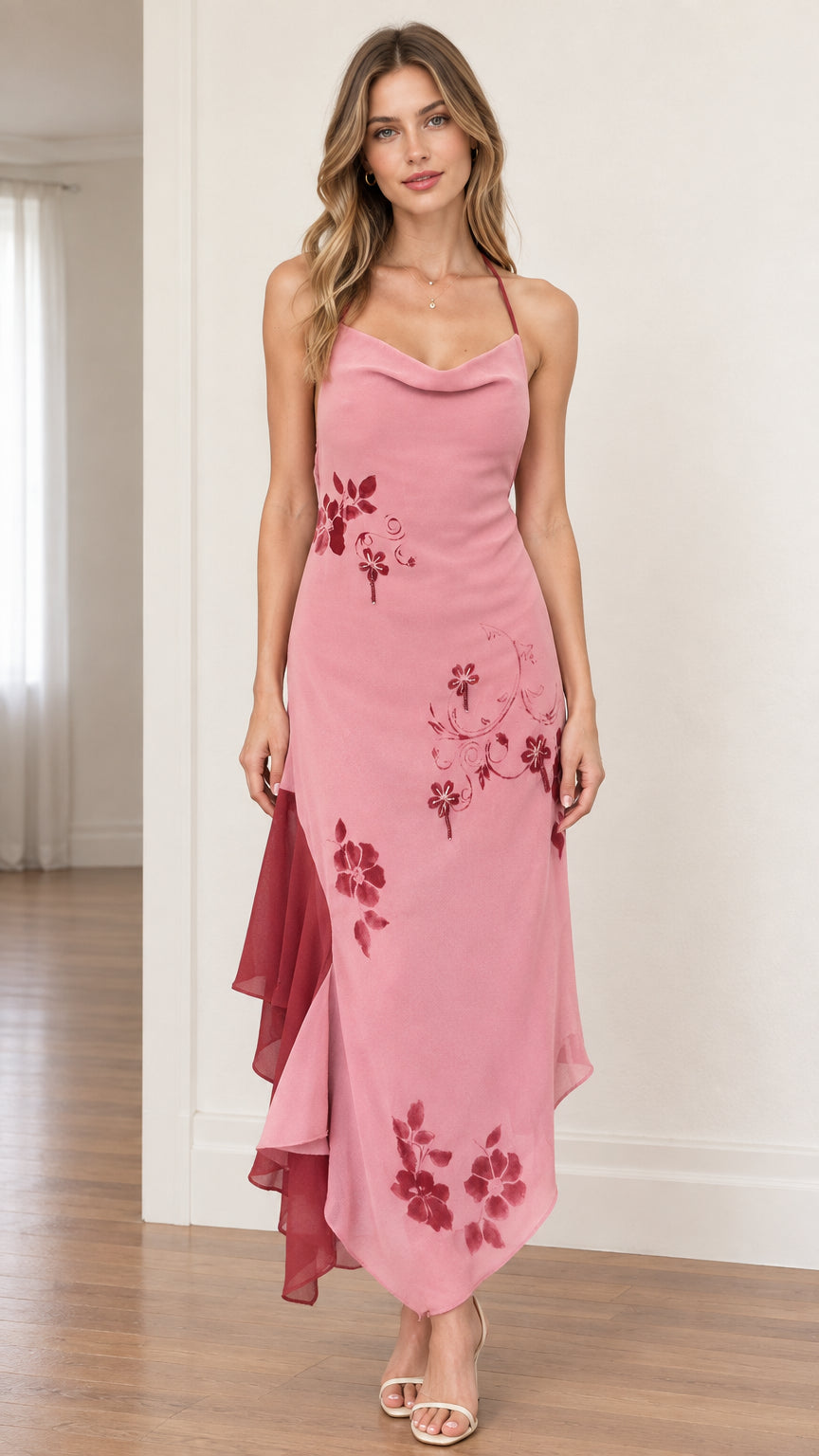 Front view of model wearing dusty rose halter cowl neck floral asymmetrical dress
