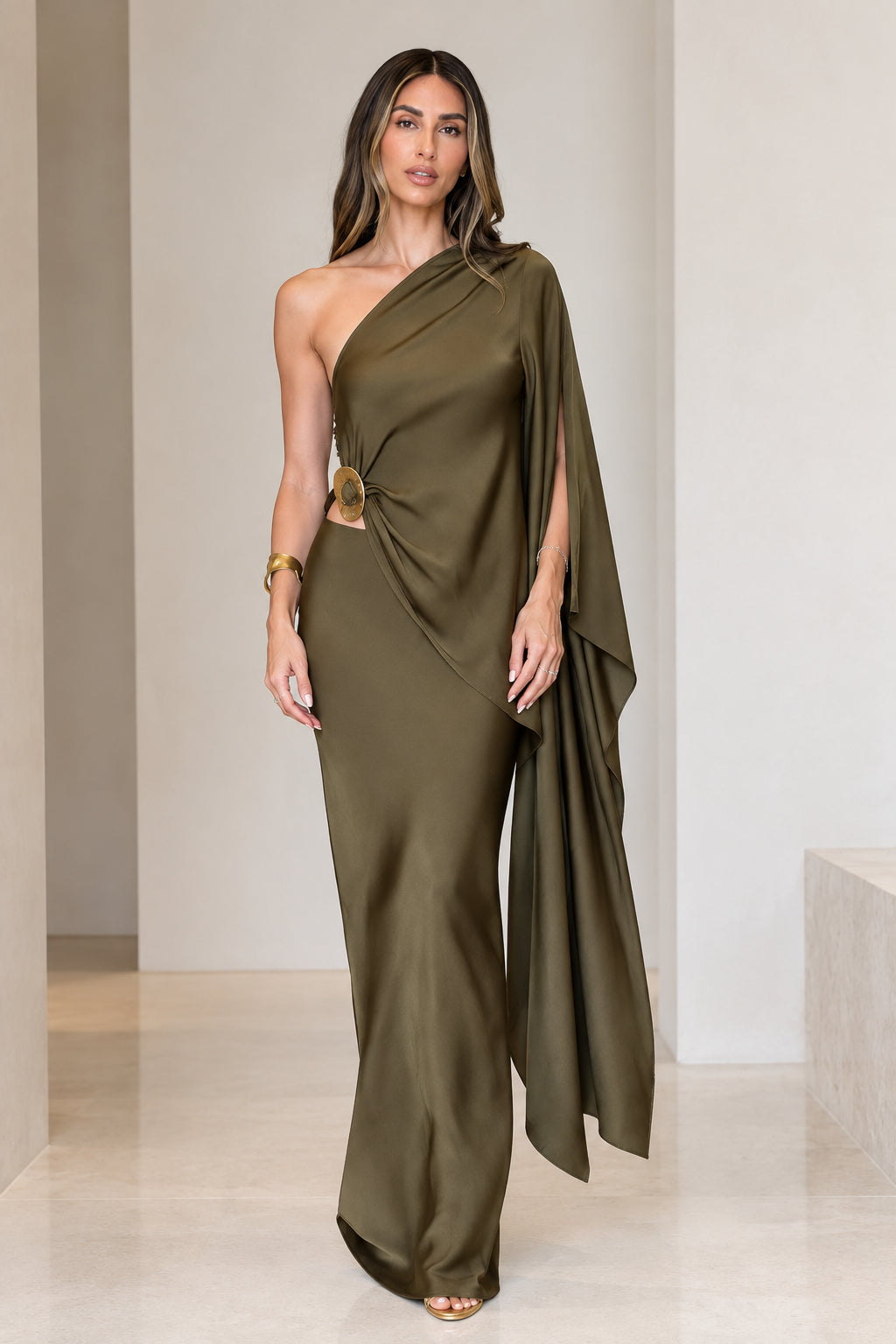 Front view of model wearing olive green one-shoulder draped satin maxi dress with cutout ring