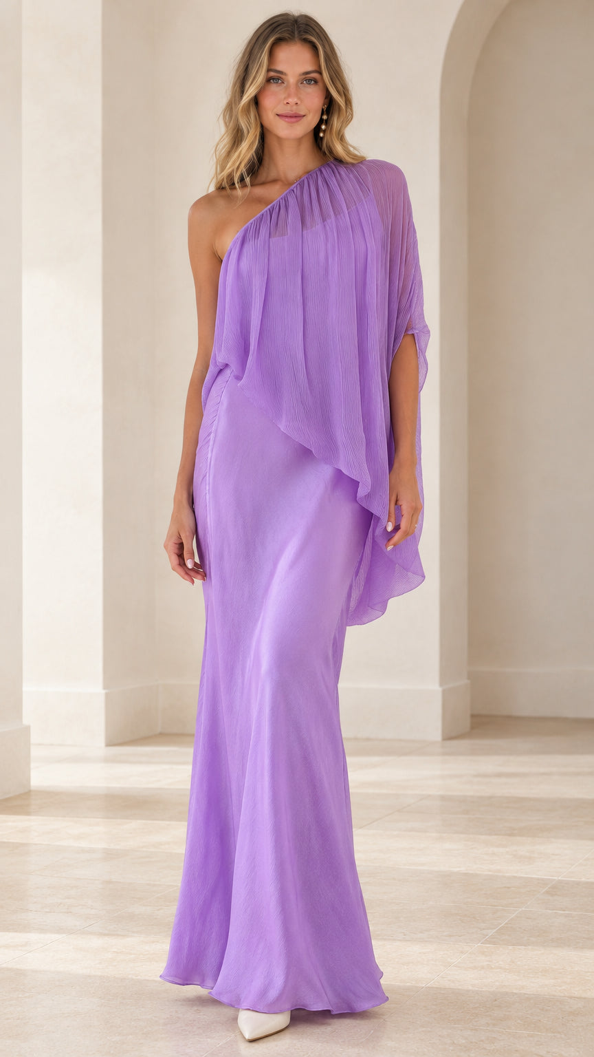 Front view of model wearing a lavender one-shoulder draped cape maxi dress