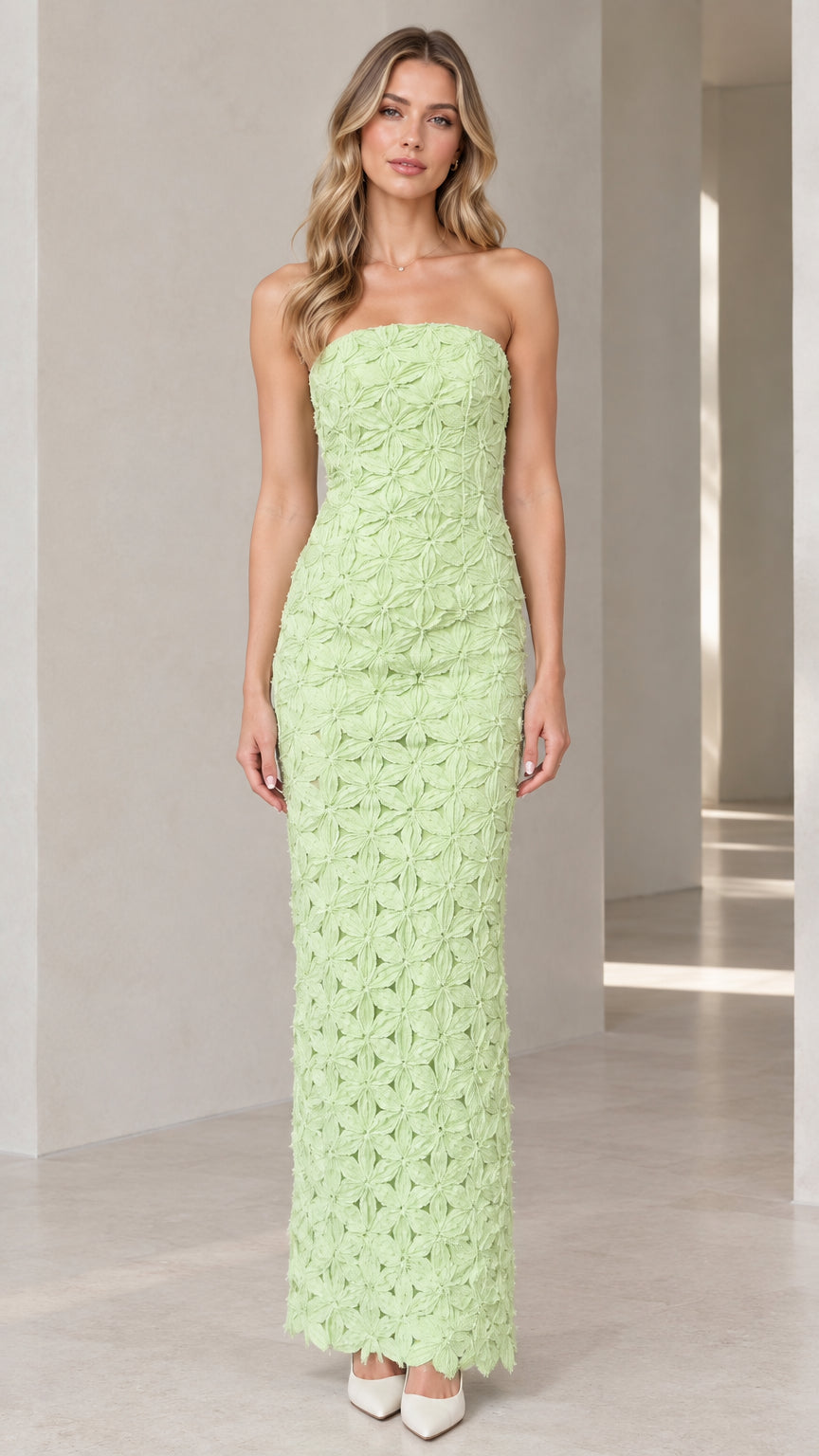 Front full-length view of model wearing mint green strapless 3D floral maxi column dress