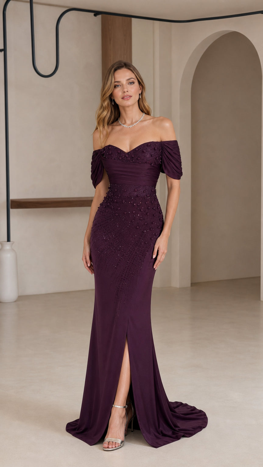 Front full-length view of woman in plum off-the-shoulder beaded evening gown with front slit