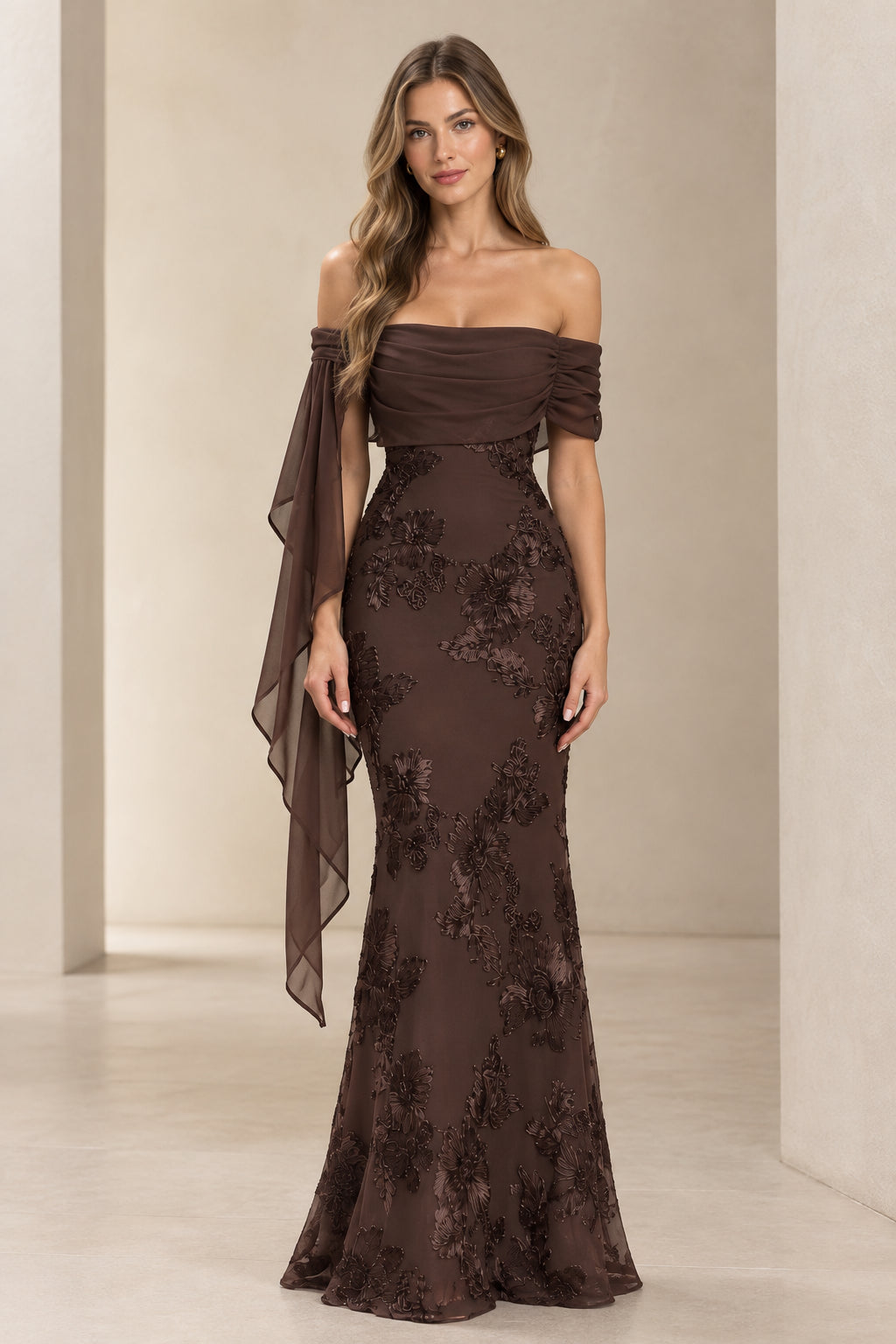 Front view of model wearing chocolate brown off-the-shoulder lace evening maxi dress with draped chiffon sleeve