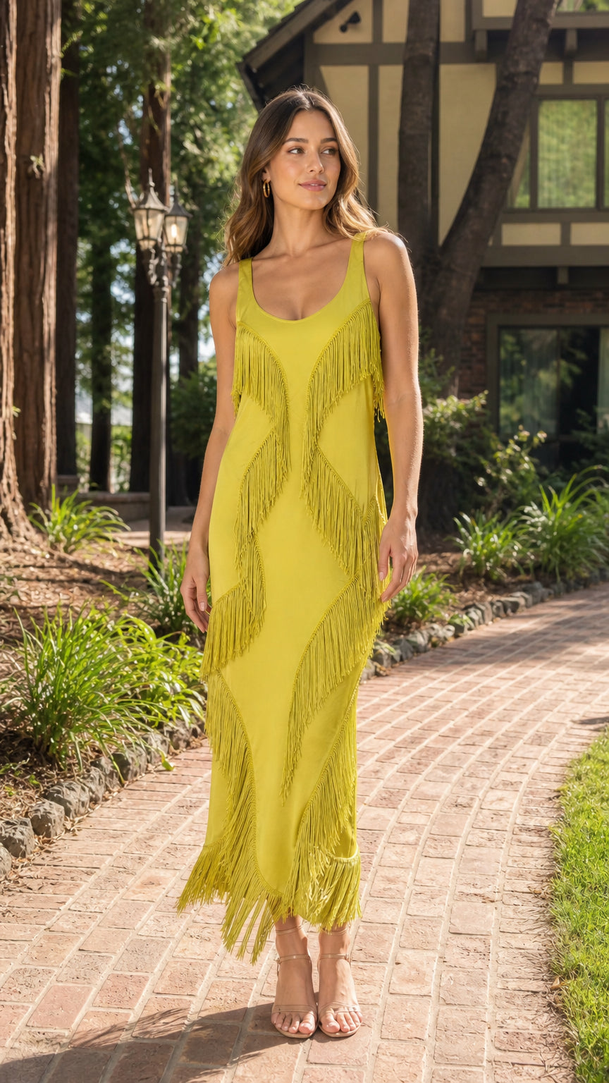 Woman wearing a chartreuse yellow sleeveless fringe maxi dress with scoop neckline front view