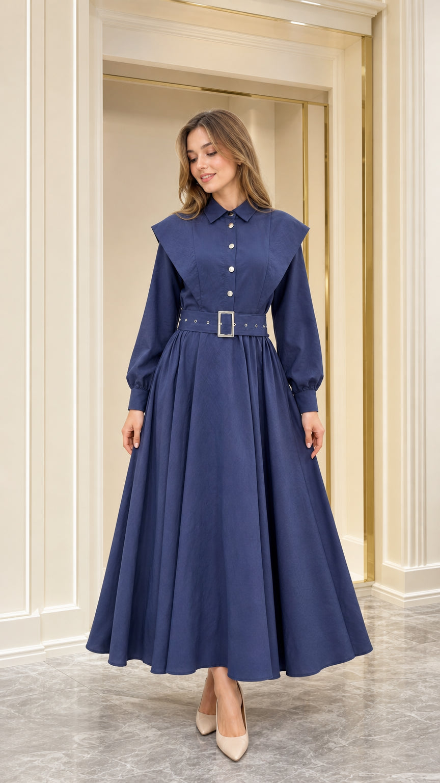 Front view of woman wearing navy blue capelet collar belted shirt maxi dress