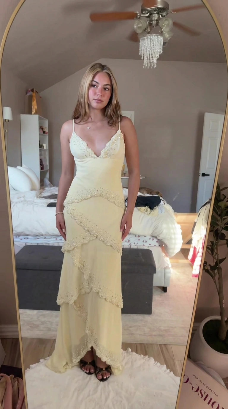 Front view of model wearing pastel yellow beaded scalloped tiered cami maxi dress