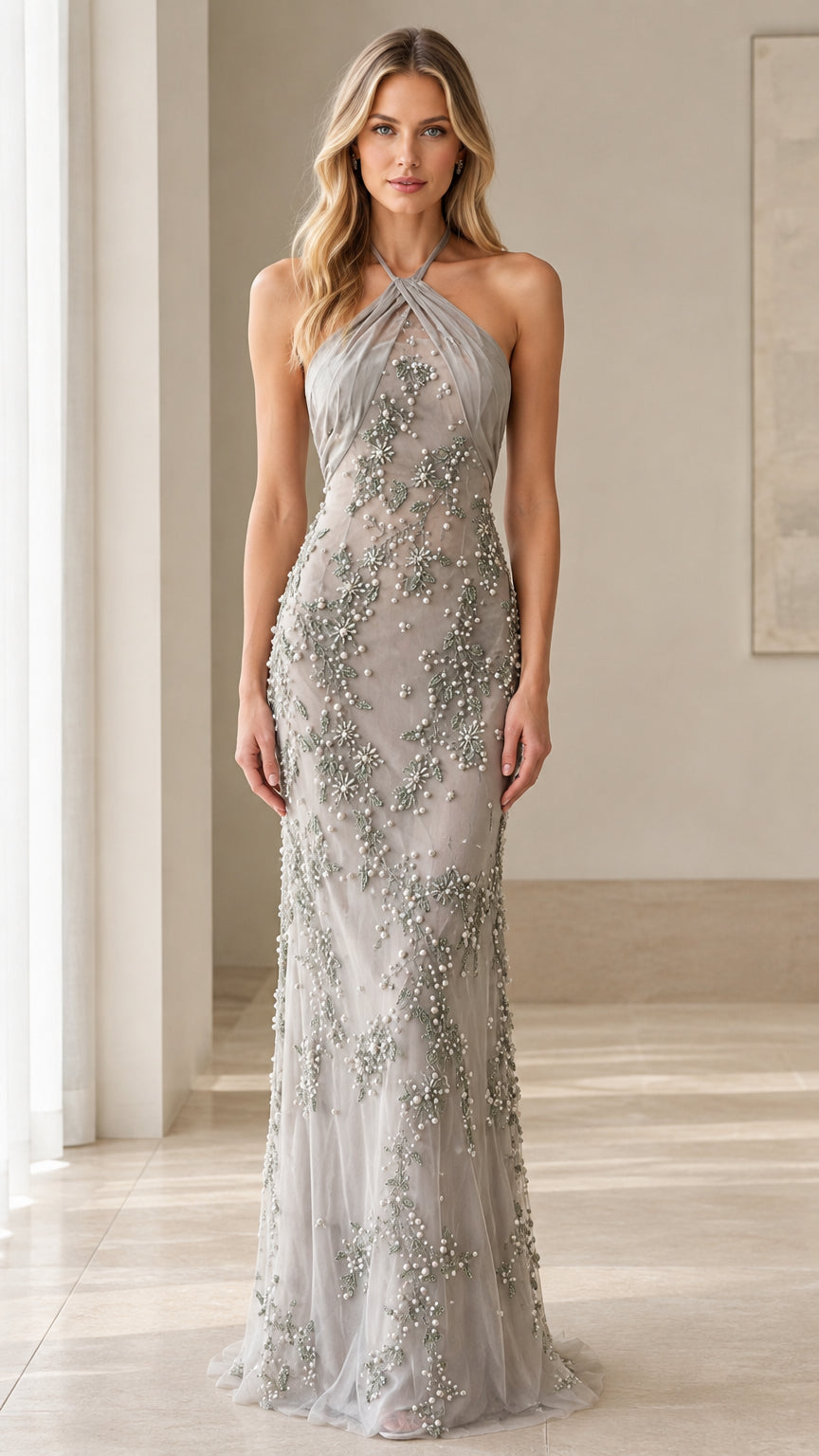 Front view of model wearing Silver Grey beaded halter evening gown
