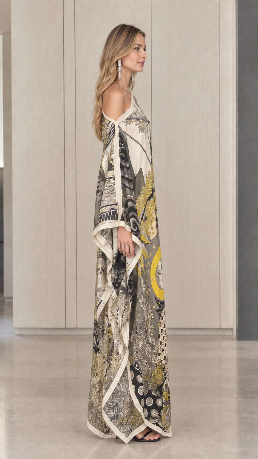 Side profile view of ivory printed one-shoulder kaftan maxi dress