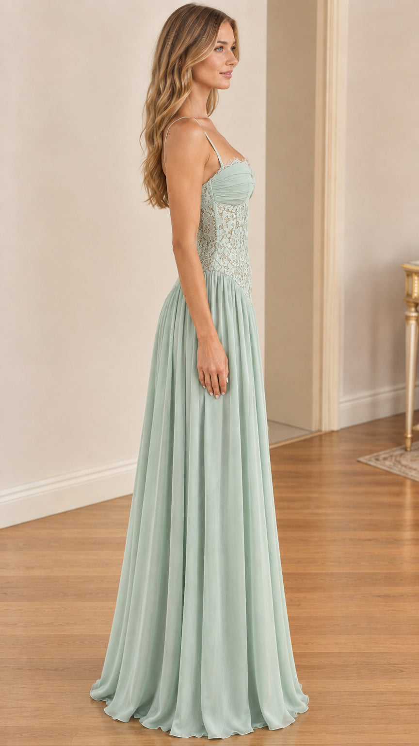 Side profile of model in sage green sweetheart lace evening gown