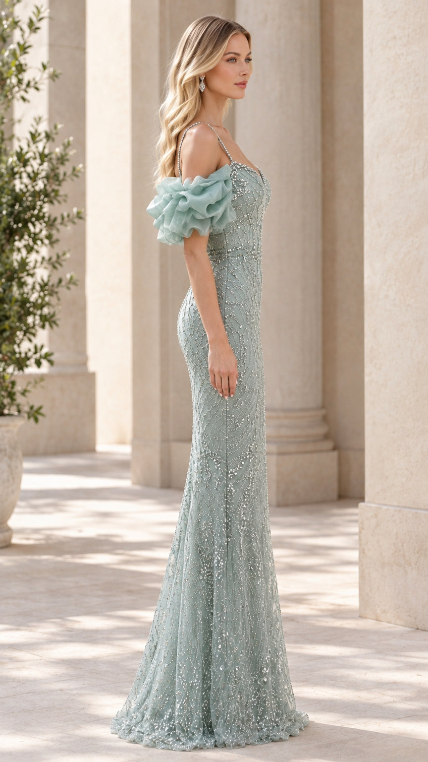 Side profile of the sage green formal dress showing fit and trailing skirt