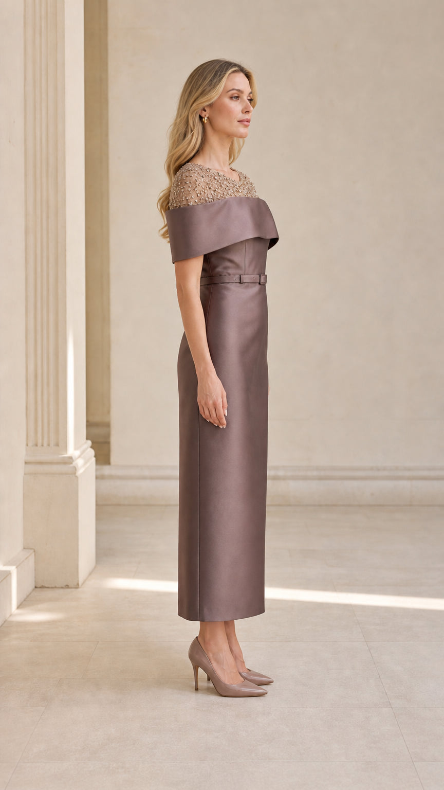 Side view of taupe evening dress with belt and midi length