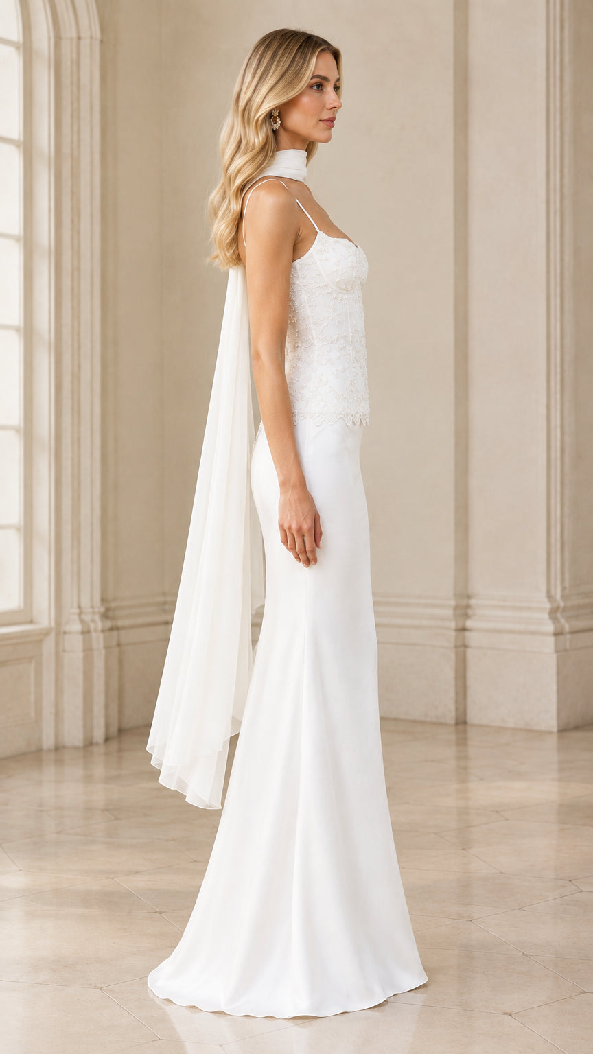 Side view of model in white beaded corset satin formal gown