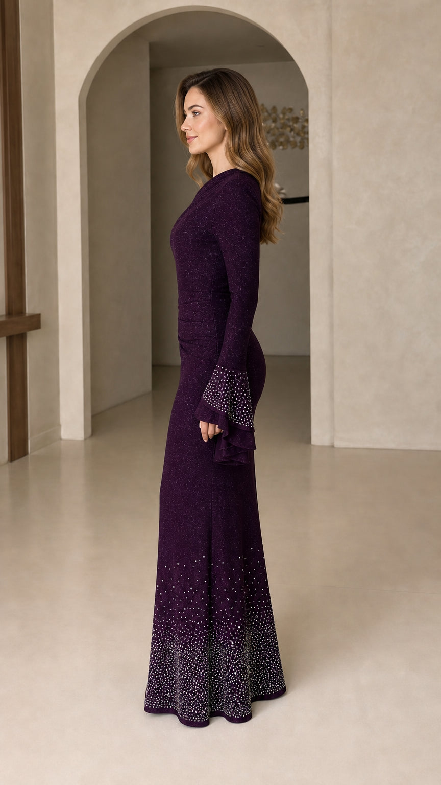 Side profile view of plum asymmetrical evening gown showing fitted silhouette