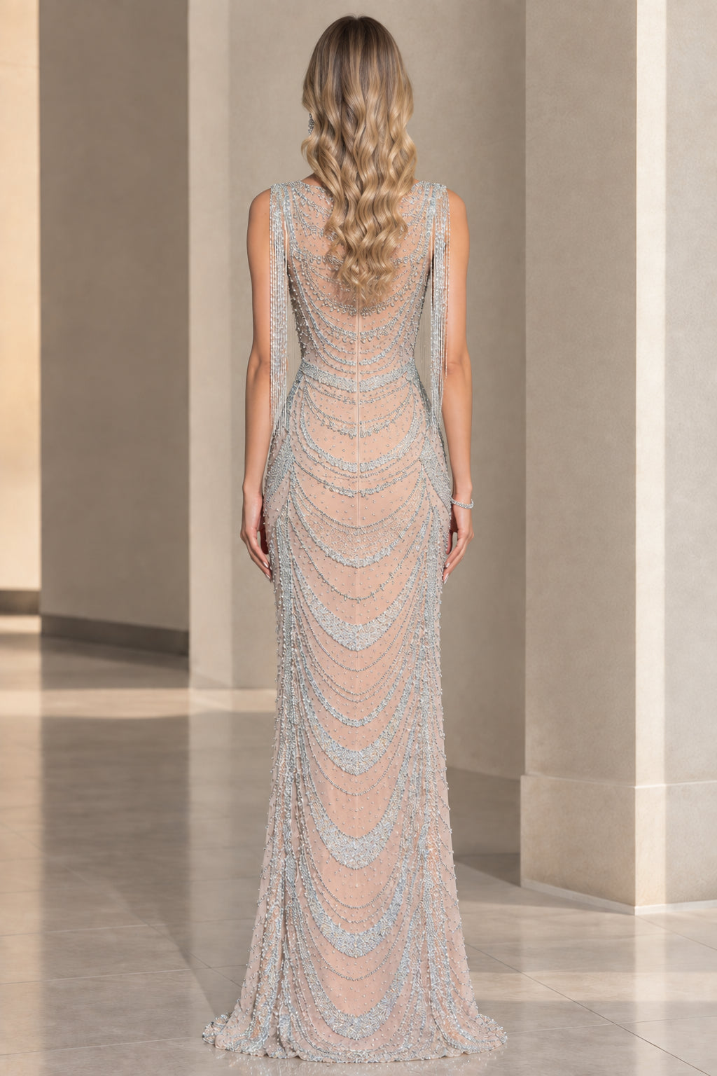 Back view of model in full-length scalloped beaded column gown