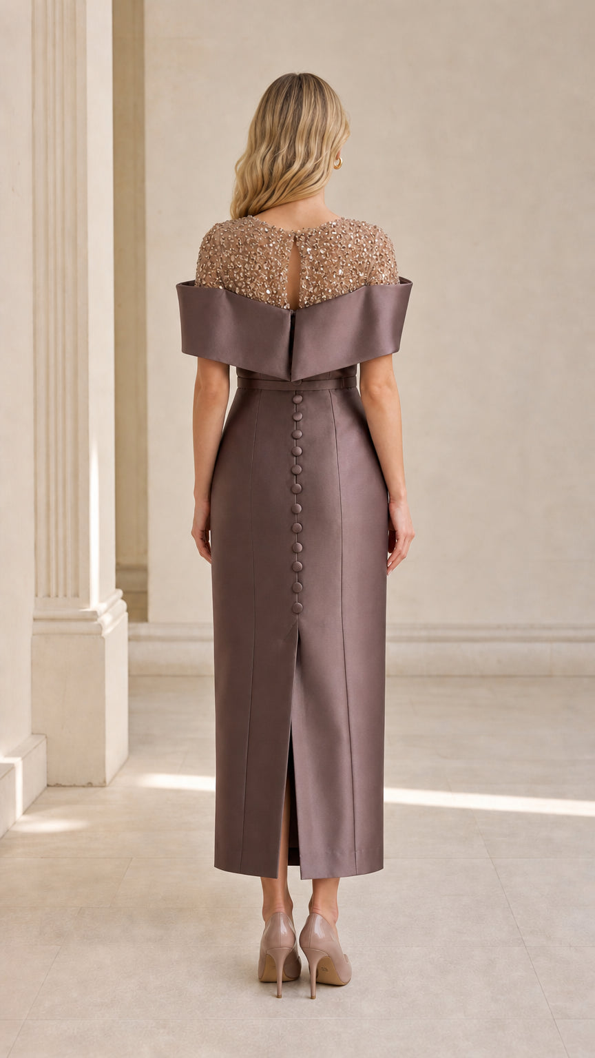 Back view showing button details and slit on taupe evening dress