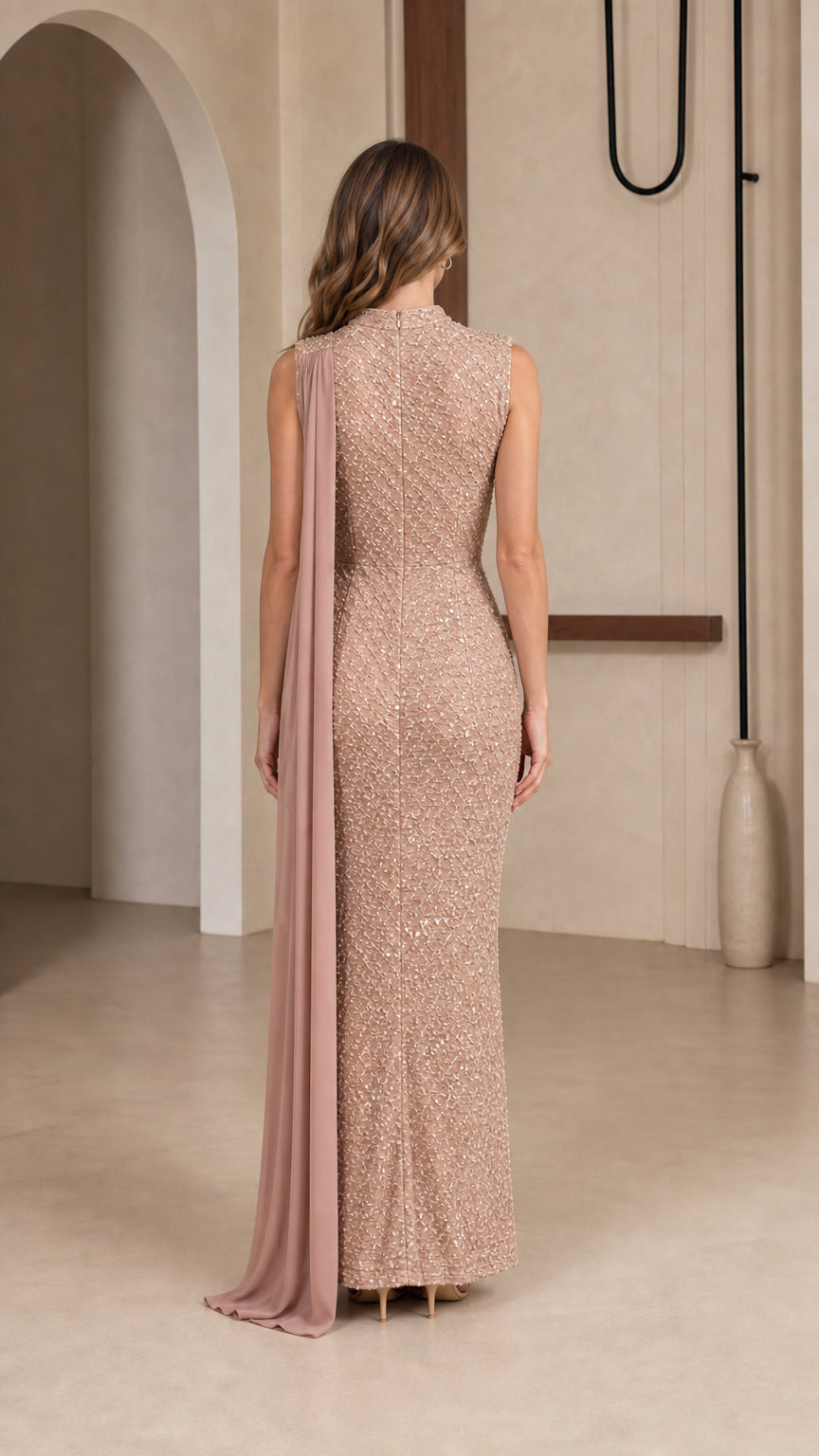 Back view of champagne sequin evening dress with shoulder capelet