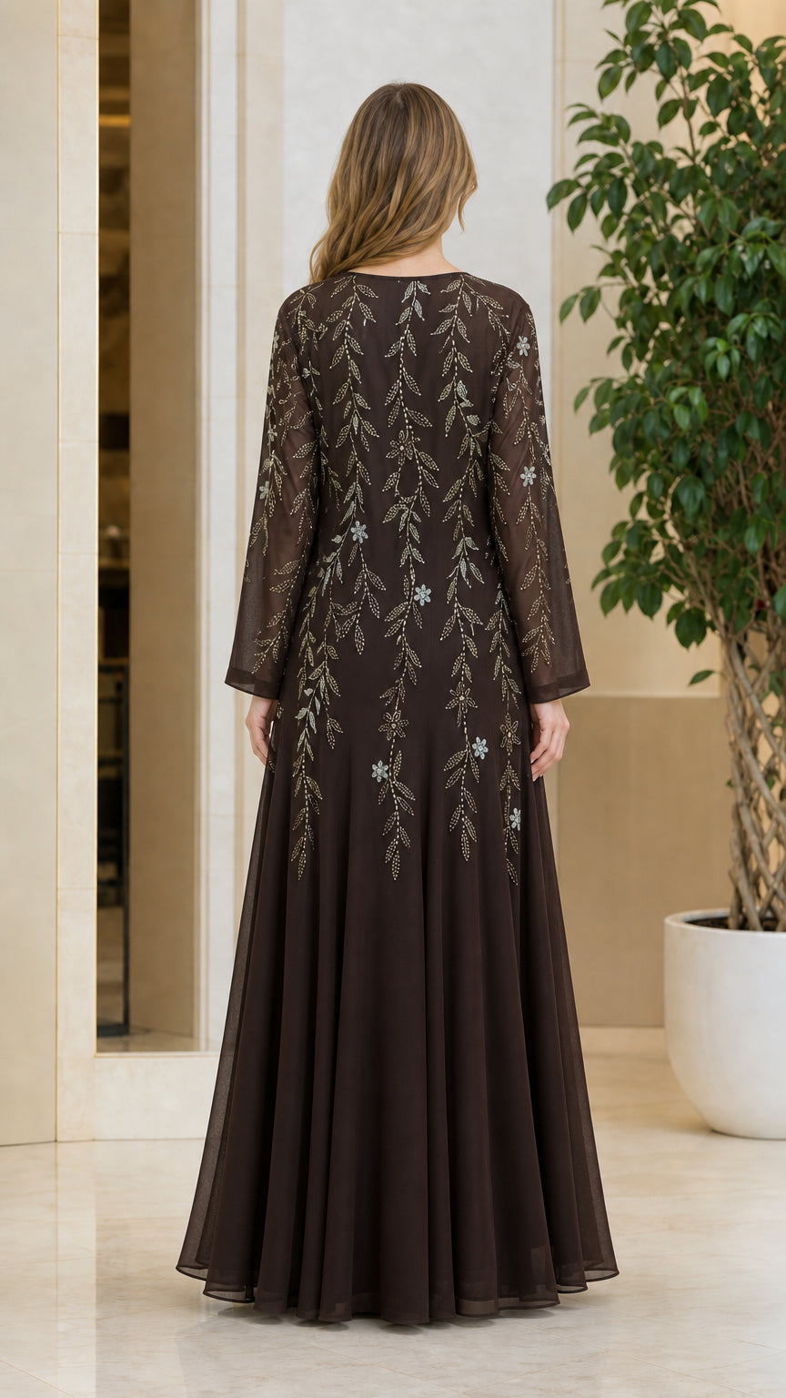 Back view of model showing the flowing drape of the Coffee brown chiffon maxi gown