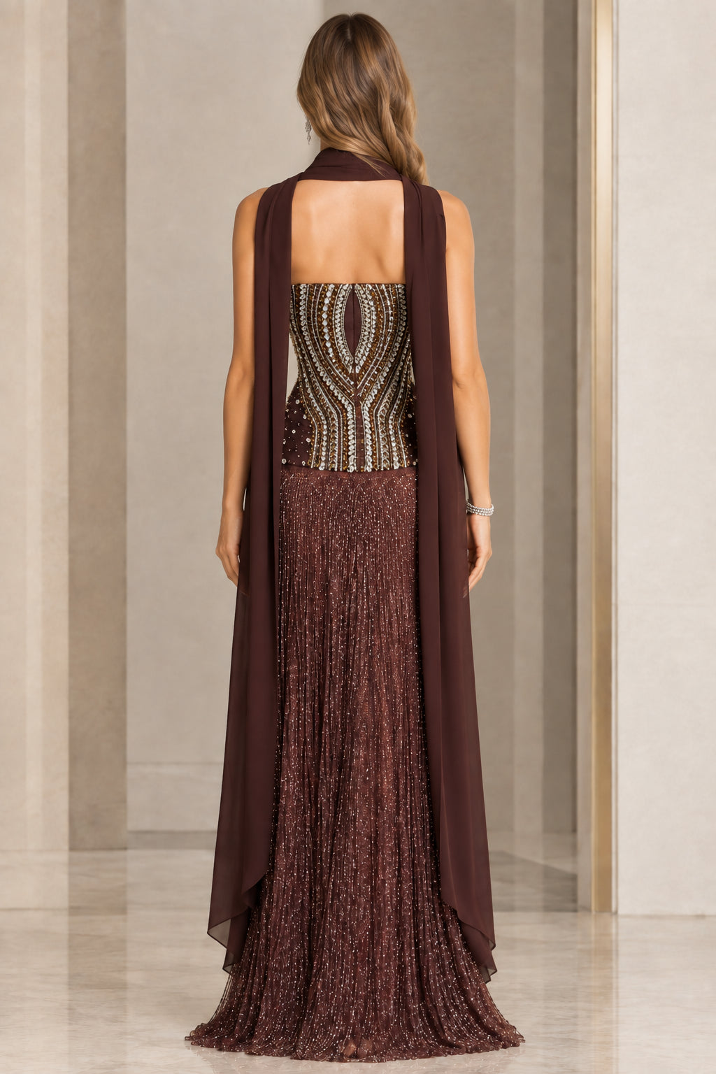 Back view of chocolate brown beaded evening dress showing cascading shoulder cape