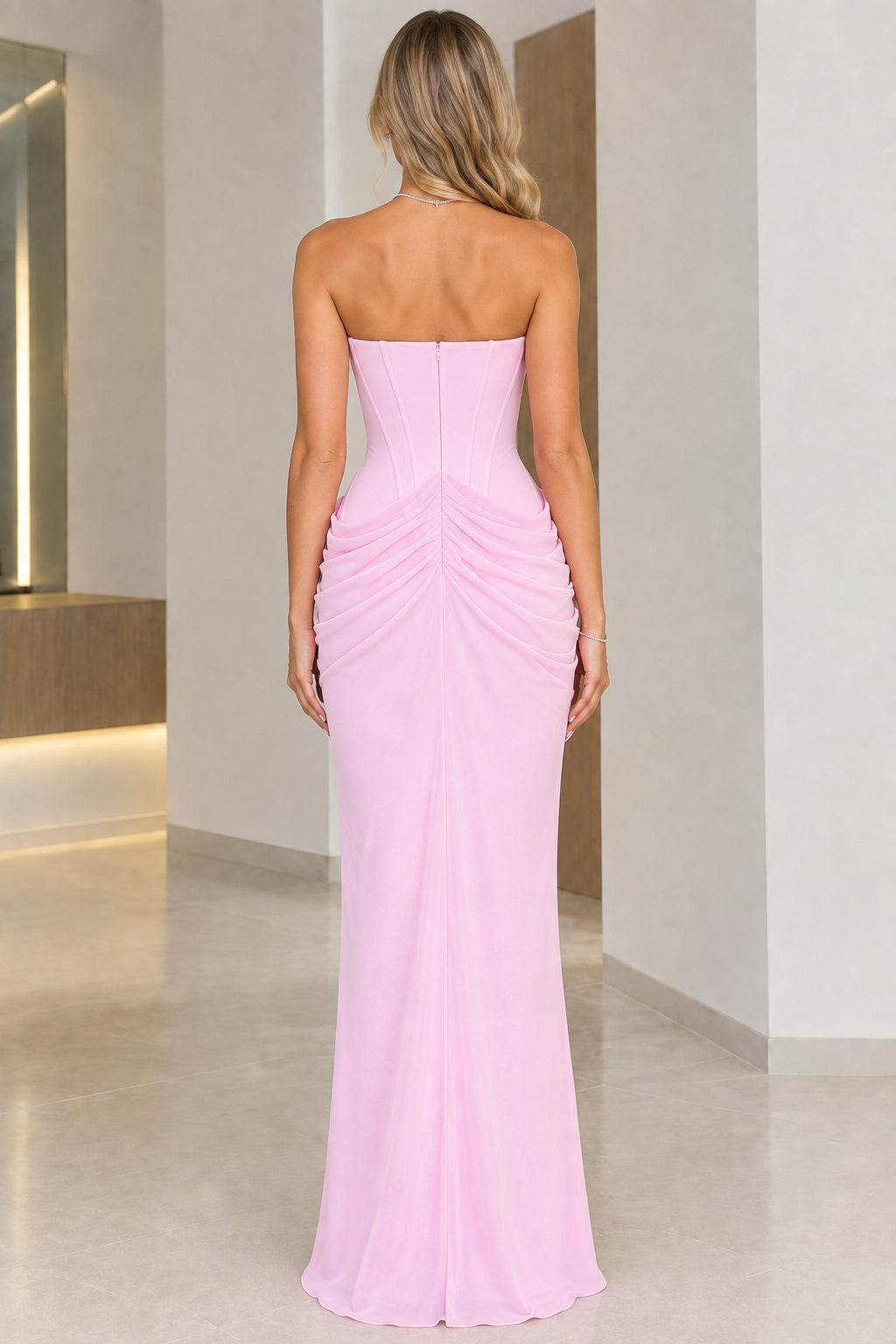 Back view of model wearing Light Pink strapless maxi gown