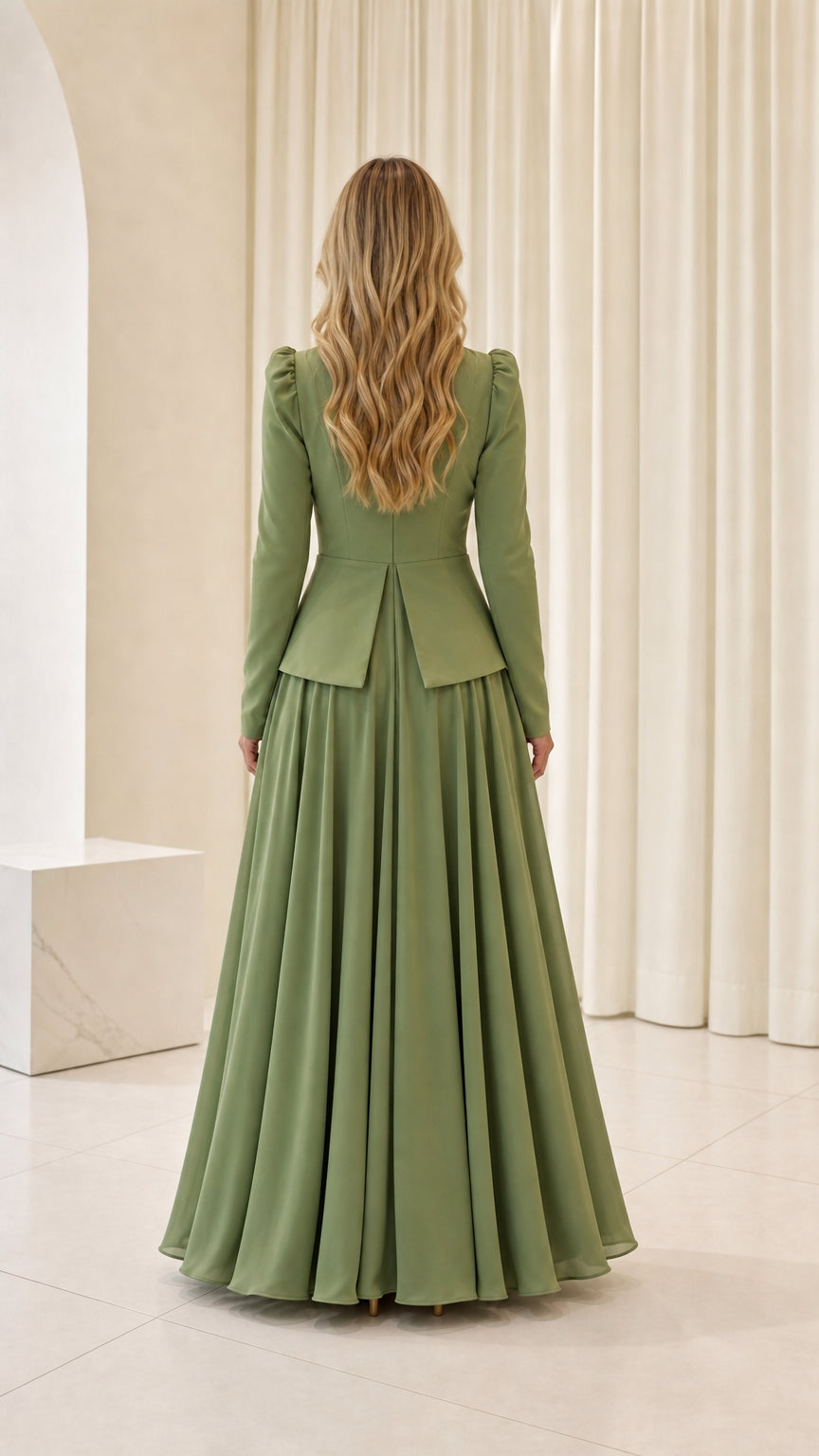 Back view of woman wearing sage green peplum bodice evening gown