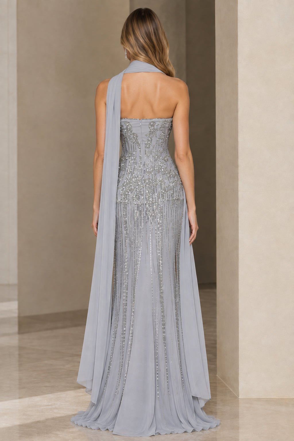 Back view of Silver Grey beaded strapless gown showing trailing chiffon scarf