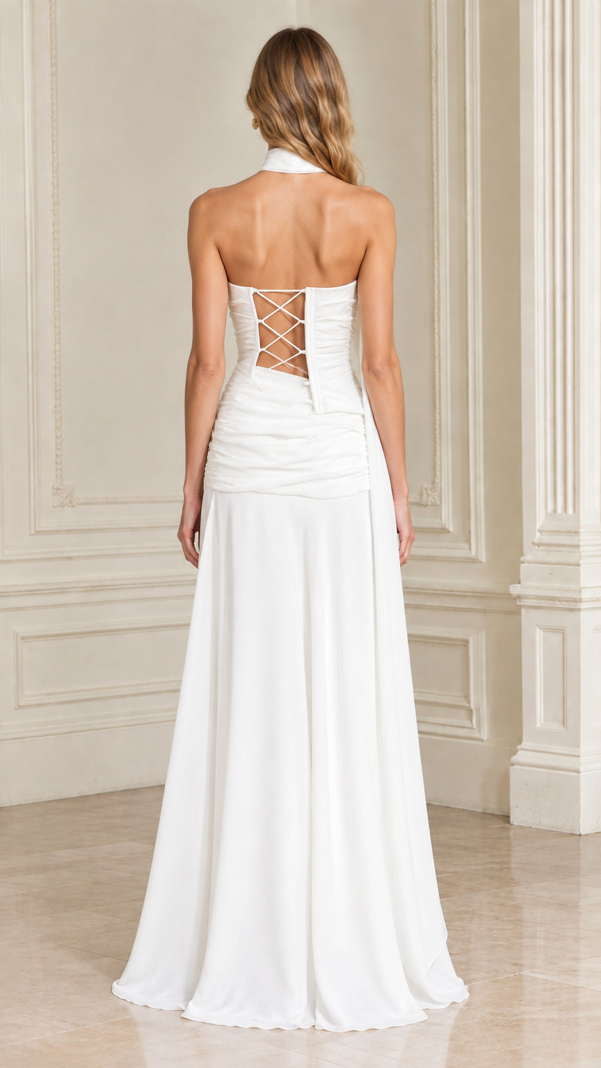 Back view of white formal gown showcasing lace-up corset back detail