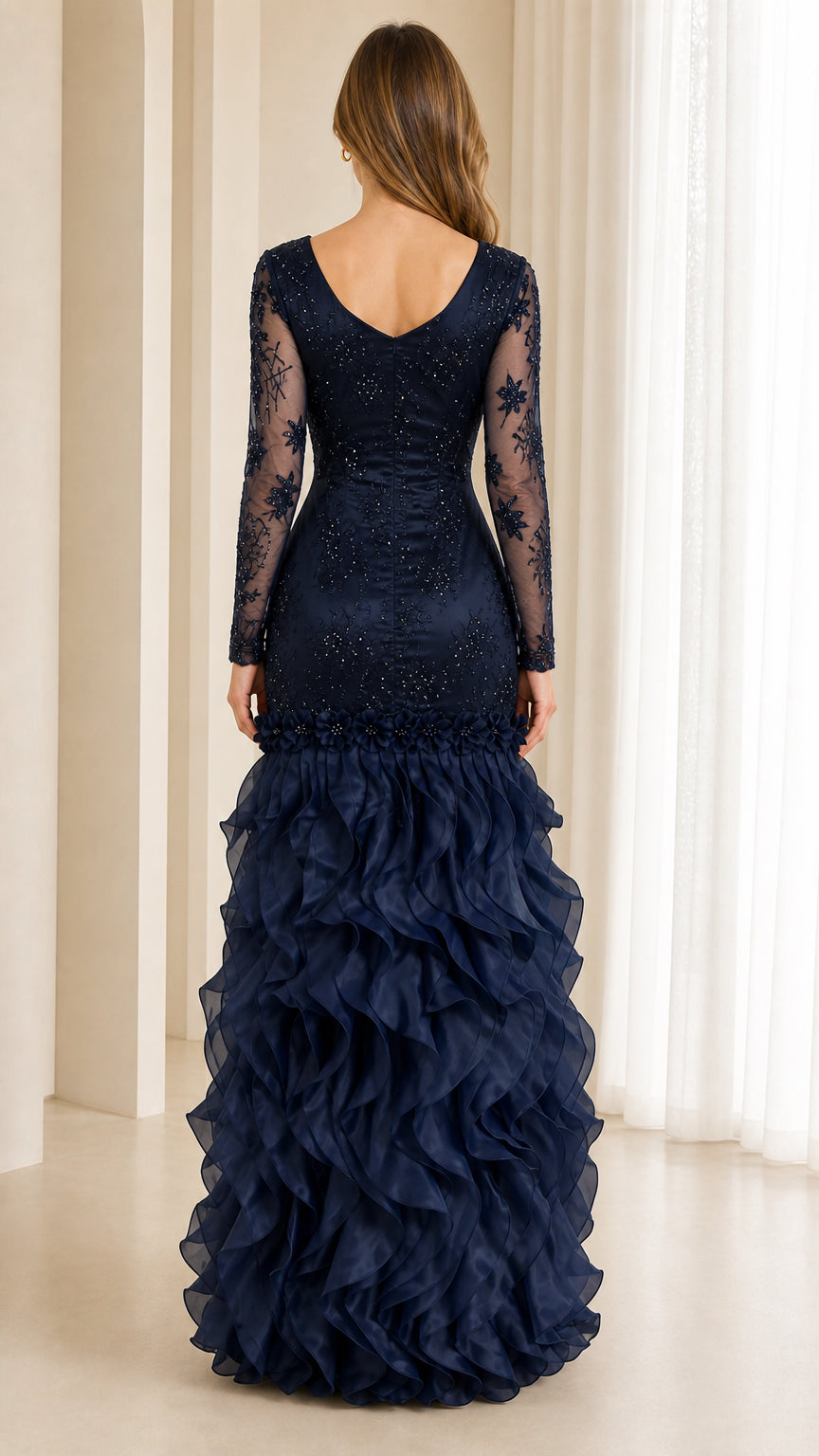 Navy blue long sleeve gown with V-back and cascading ruffle skirt back view