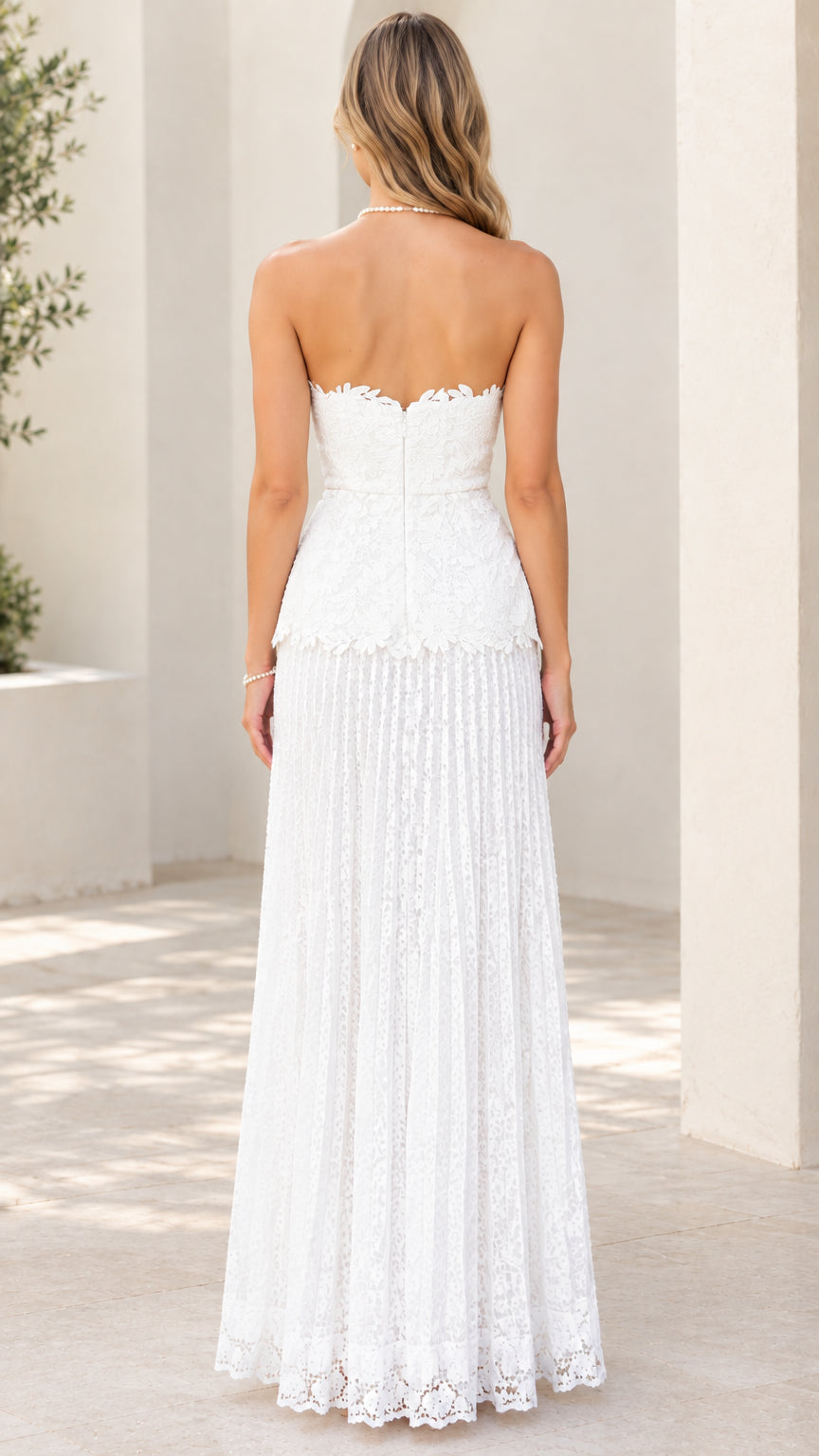 Back view of white strapless lace maxi dress showing concealed zipper closure