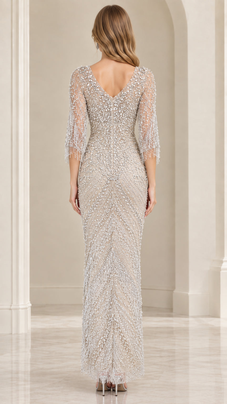 Back view of Champagne V-back embellished evening gown