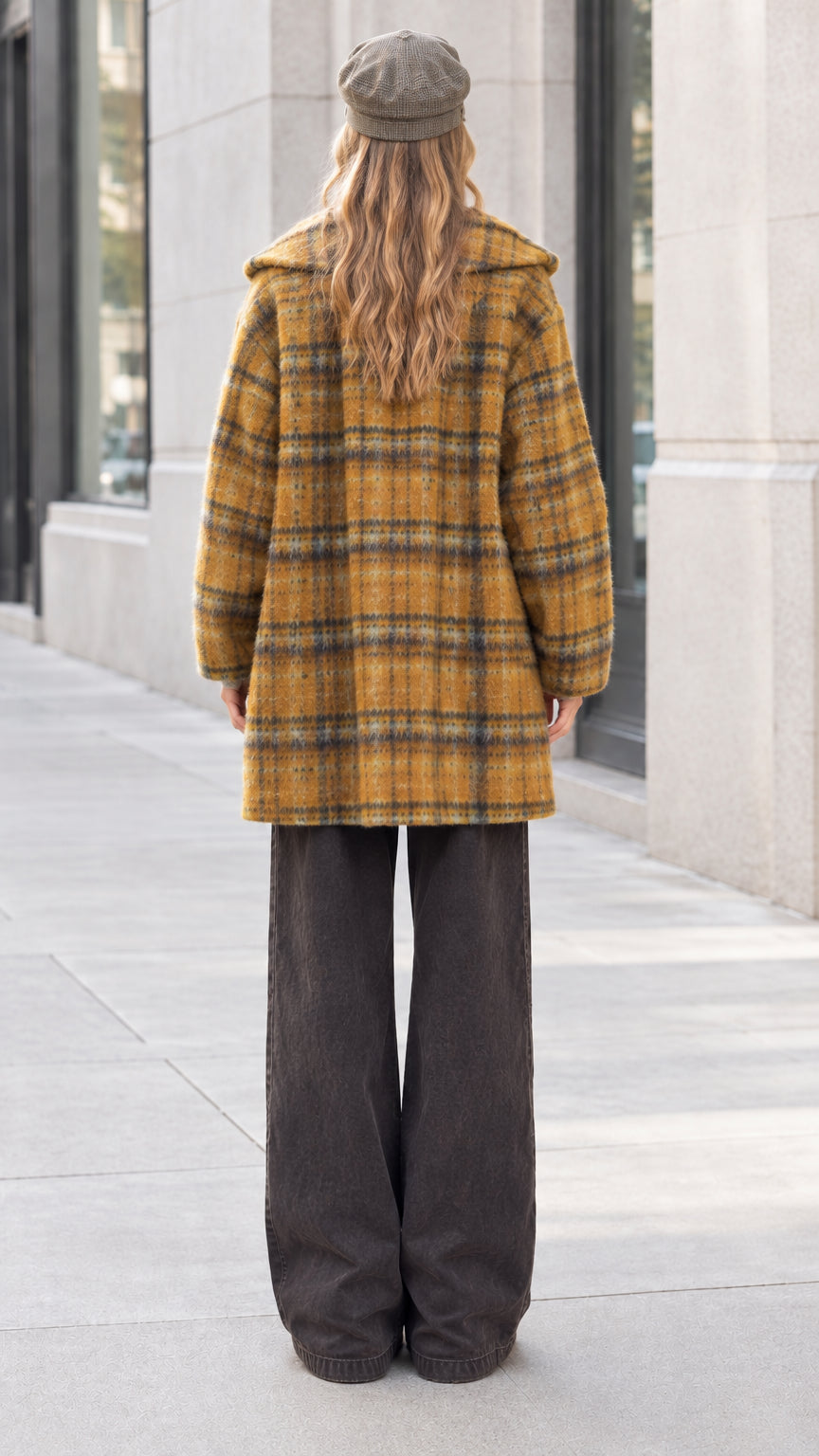 Back view of model wearing mustard yellow plaid mid-length casual jacket