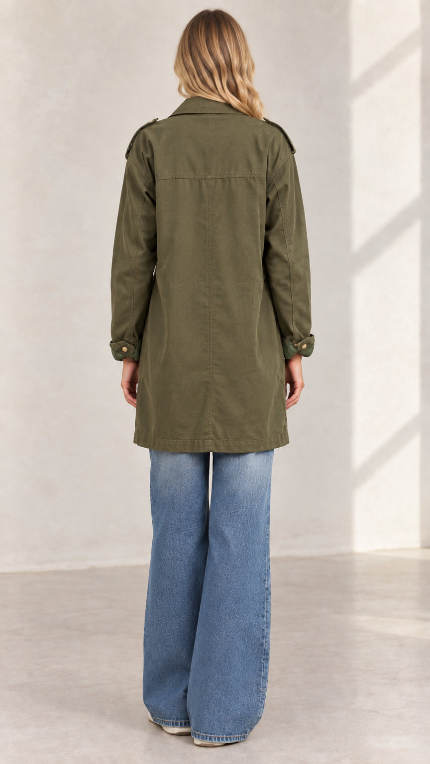 Back view of women's army green casual mid-length cargo jacket