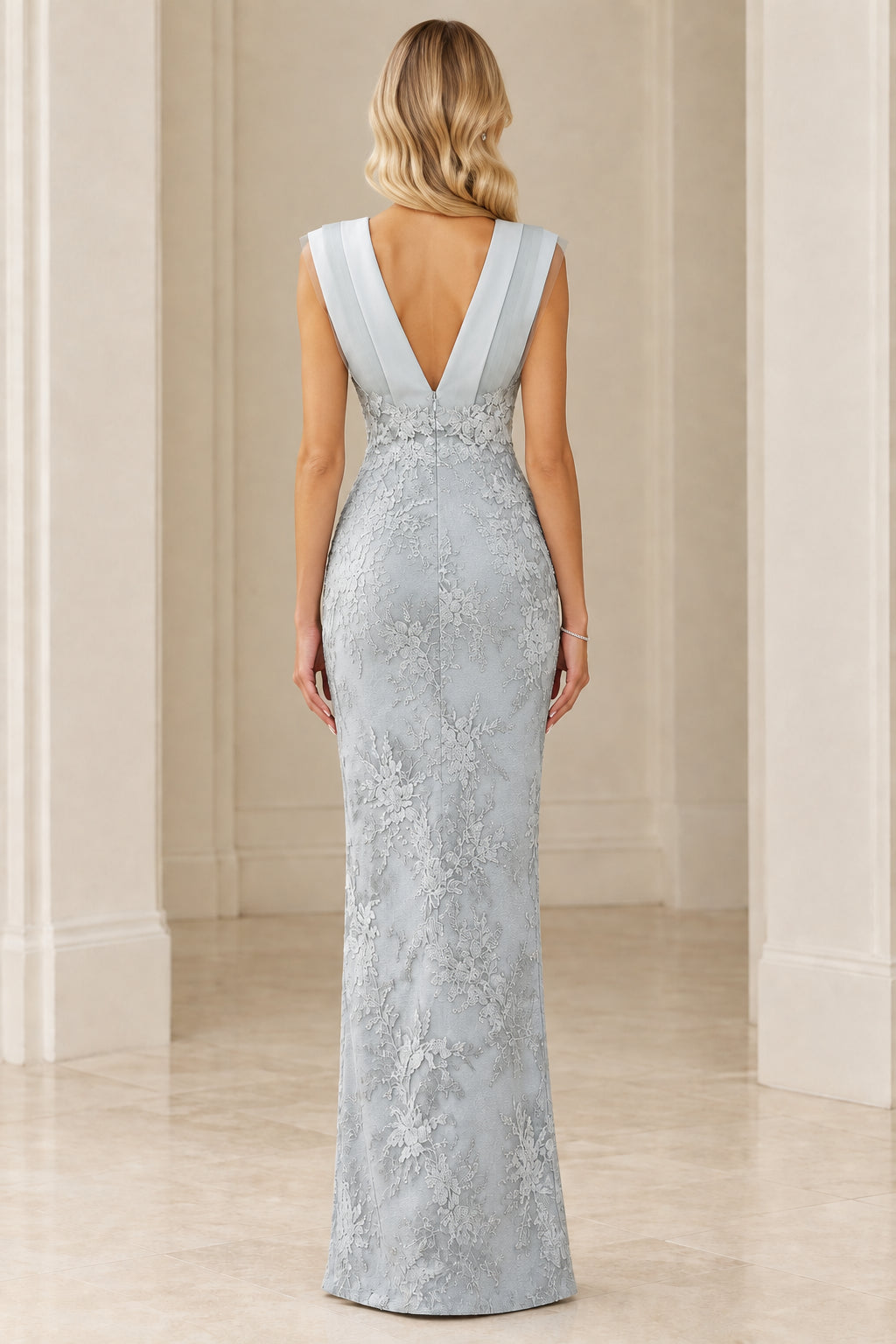 Back view of Ice Blue gown showing deep V-back and lace detailing
