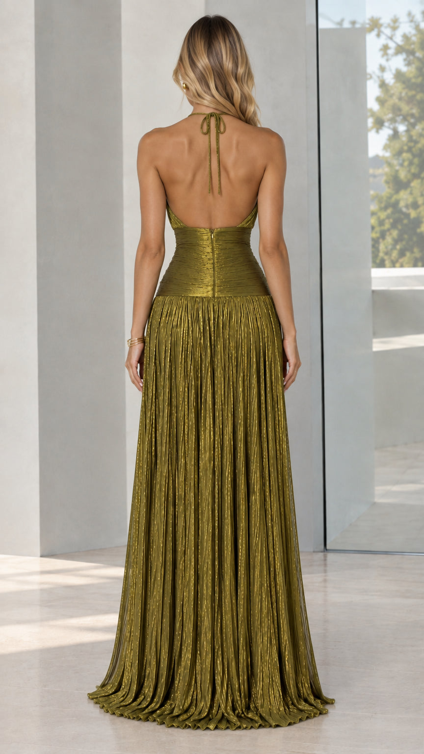 Back view of model wearing olive green open-back halter pleated maxi dress