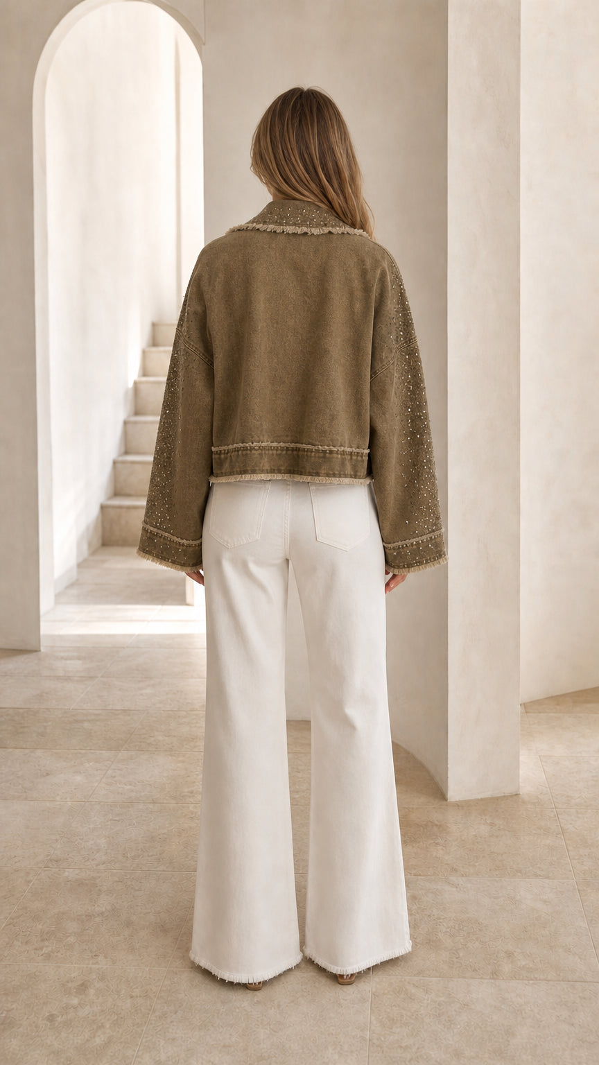 Back view of olive green fringe jacket showing relaxed fit and frayed hem