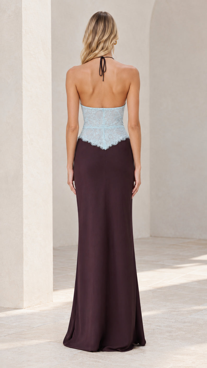 Back view of model showing open back and tie-neck closure on halter gown