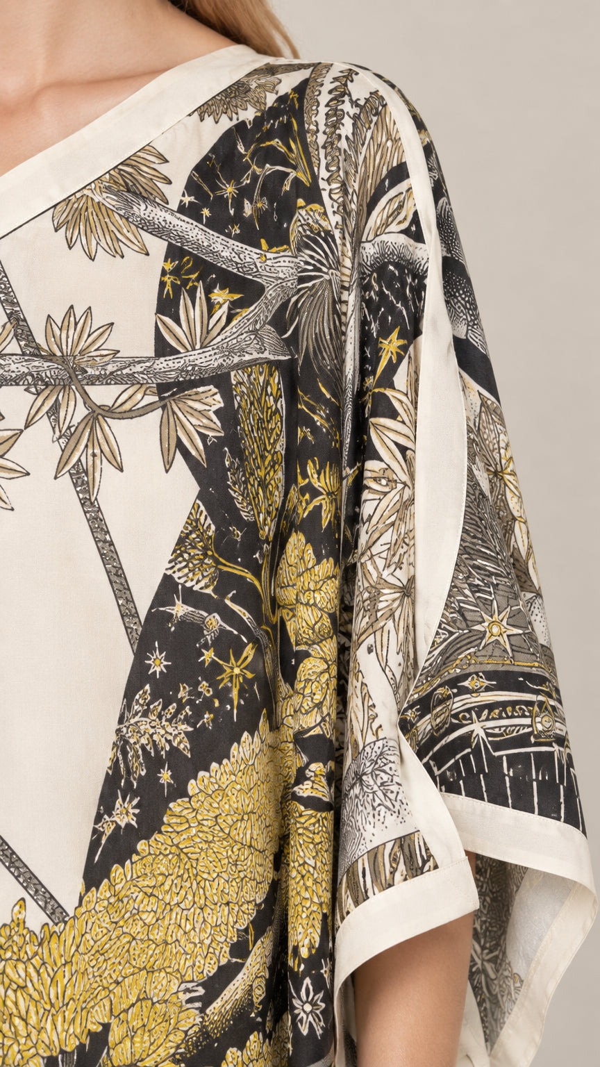 Close-up detail of celestial sun and palm scarf print fabric