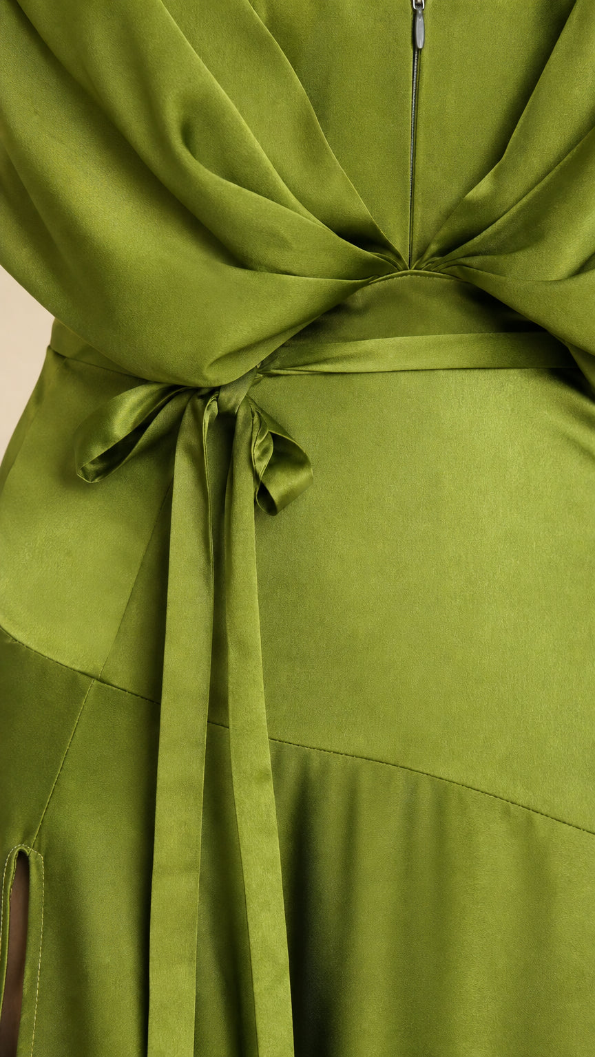 Close-up detail of waist tie and draped gathering on olive green satin gown