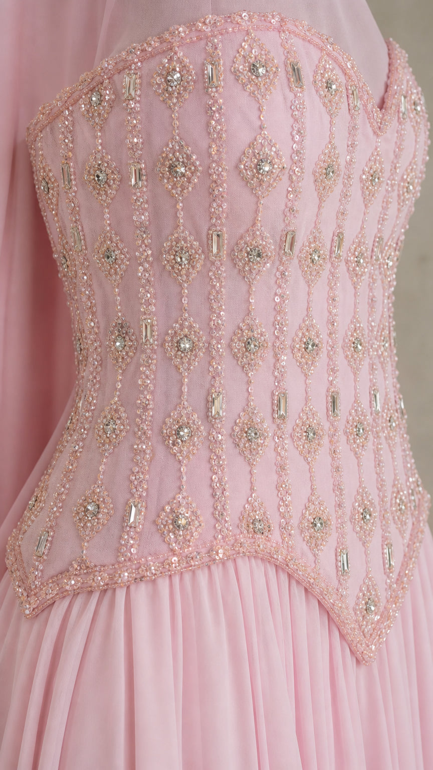 Close-up detail of intricate beading and crystal embellishments on sweetheart corset bodice