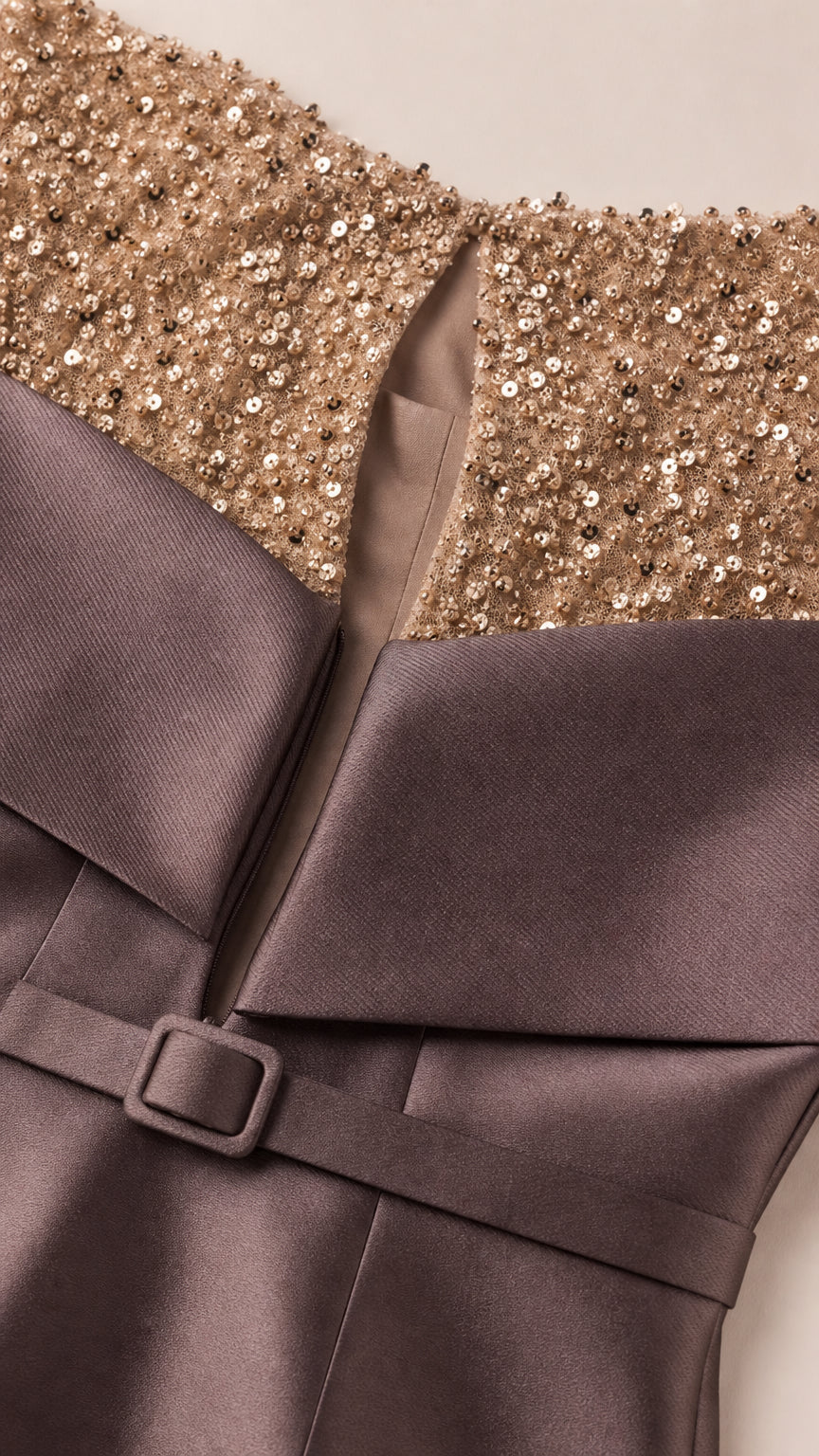 Close-up of sequin yoke and draped collar detail