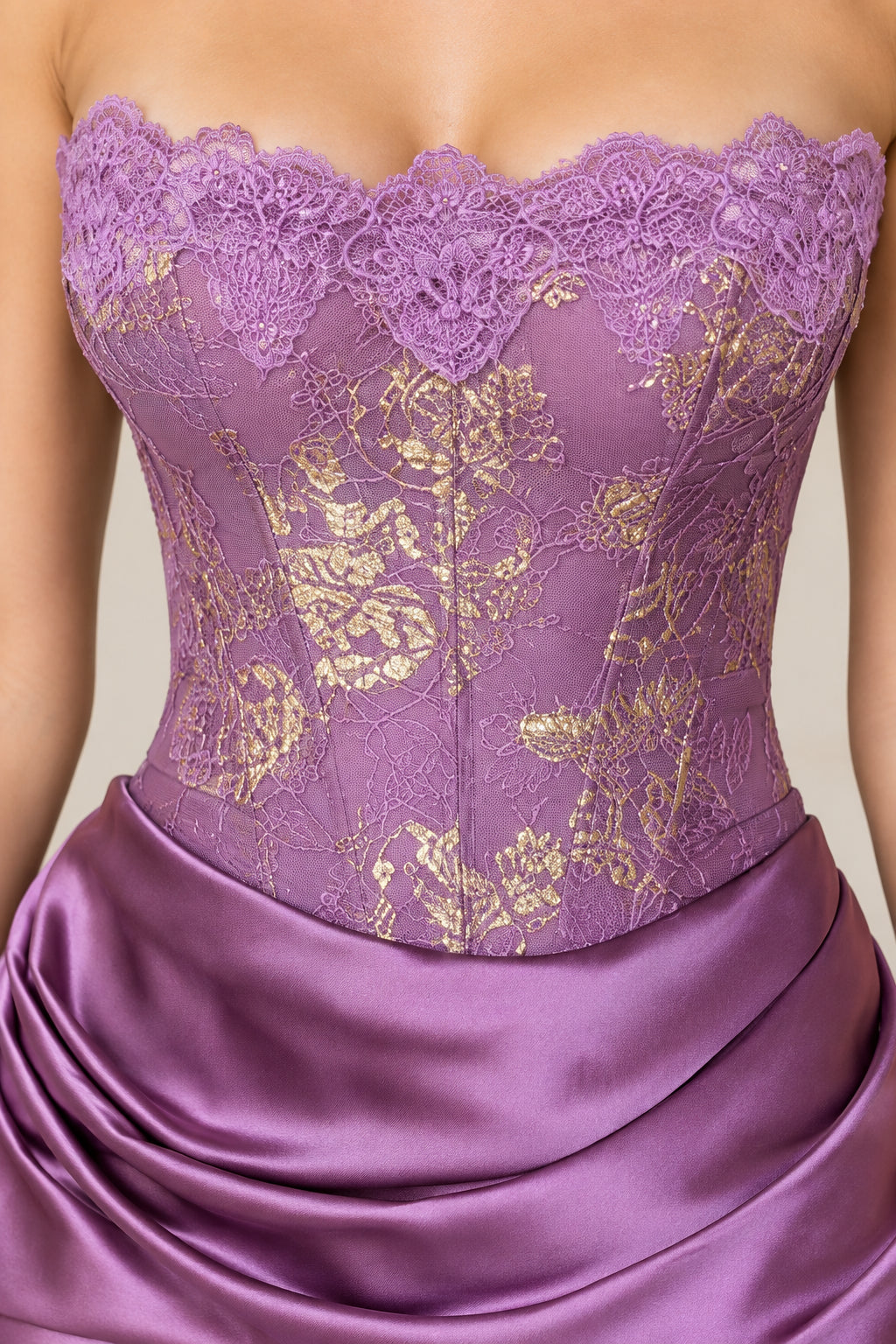 Close-up of purple lace corset bodice with boning and gold floral embroidery