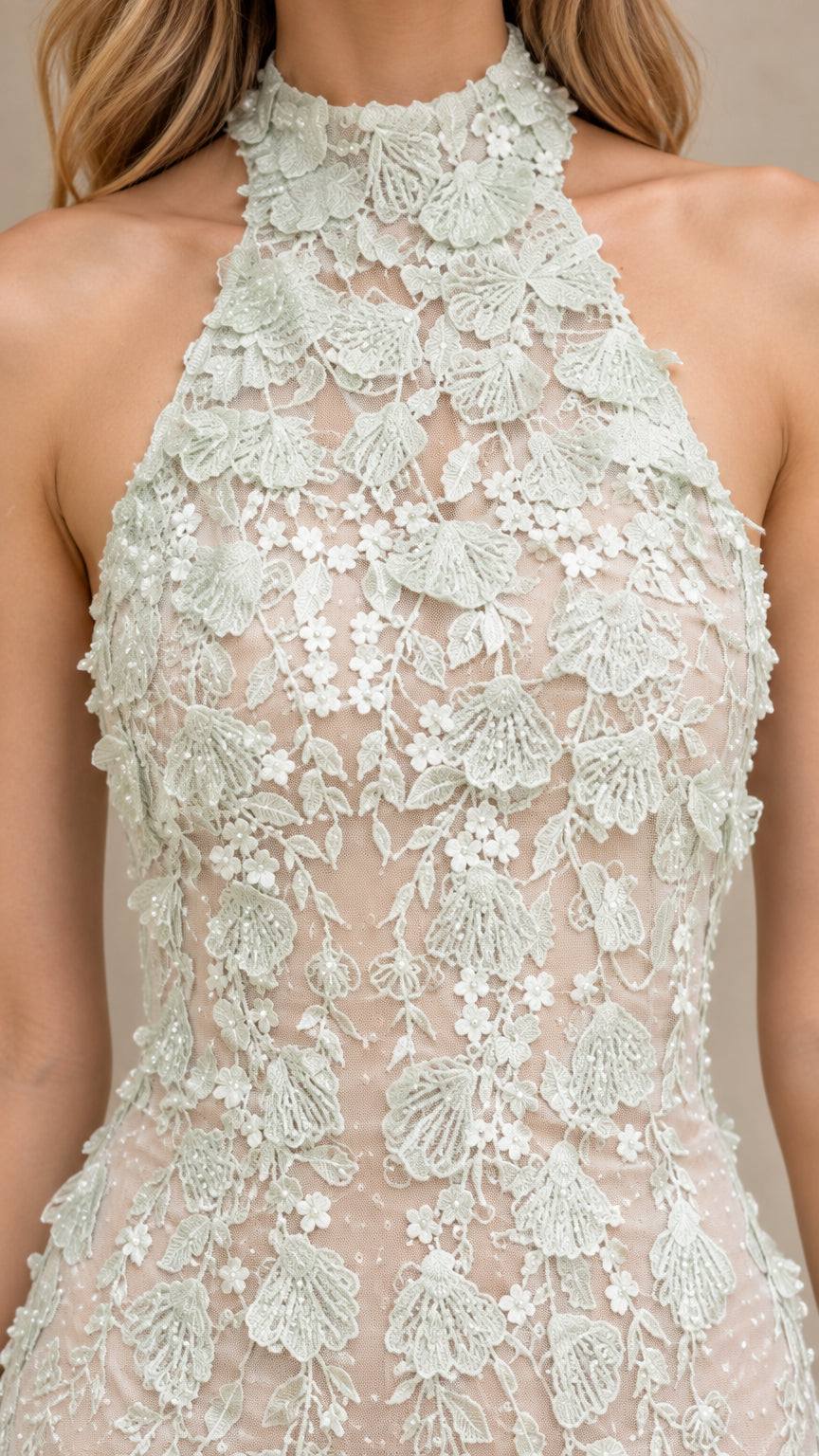 Close-up detail of 3D floral applique embroidery on halter neckline bodice