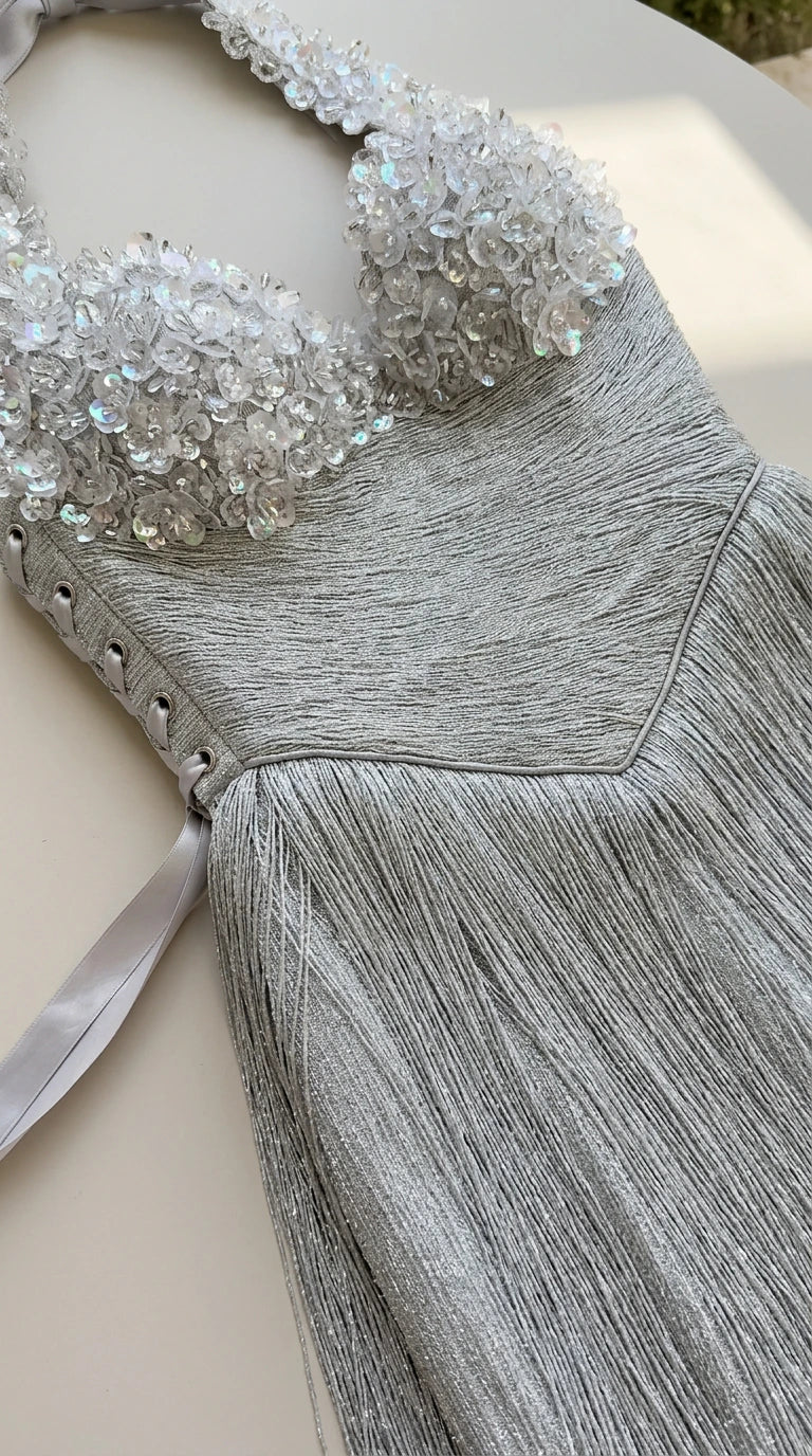 Close up view of silver 3D floral crystal beading and corset lace-up