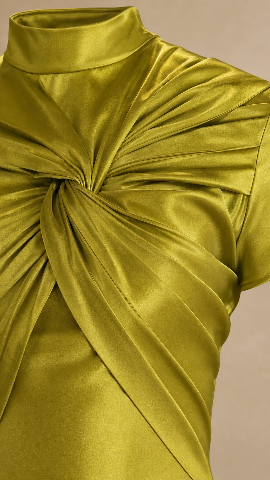 Close-up detail of pleated twist-knot neckline on olive green satin gown