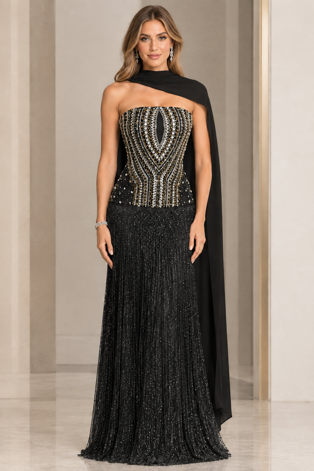 Black strapless beaded corset evening gown with trailing cape scarf