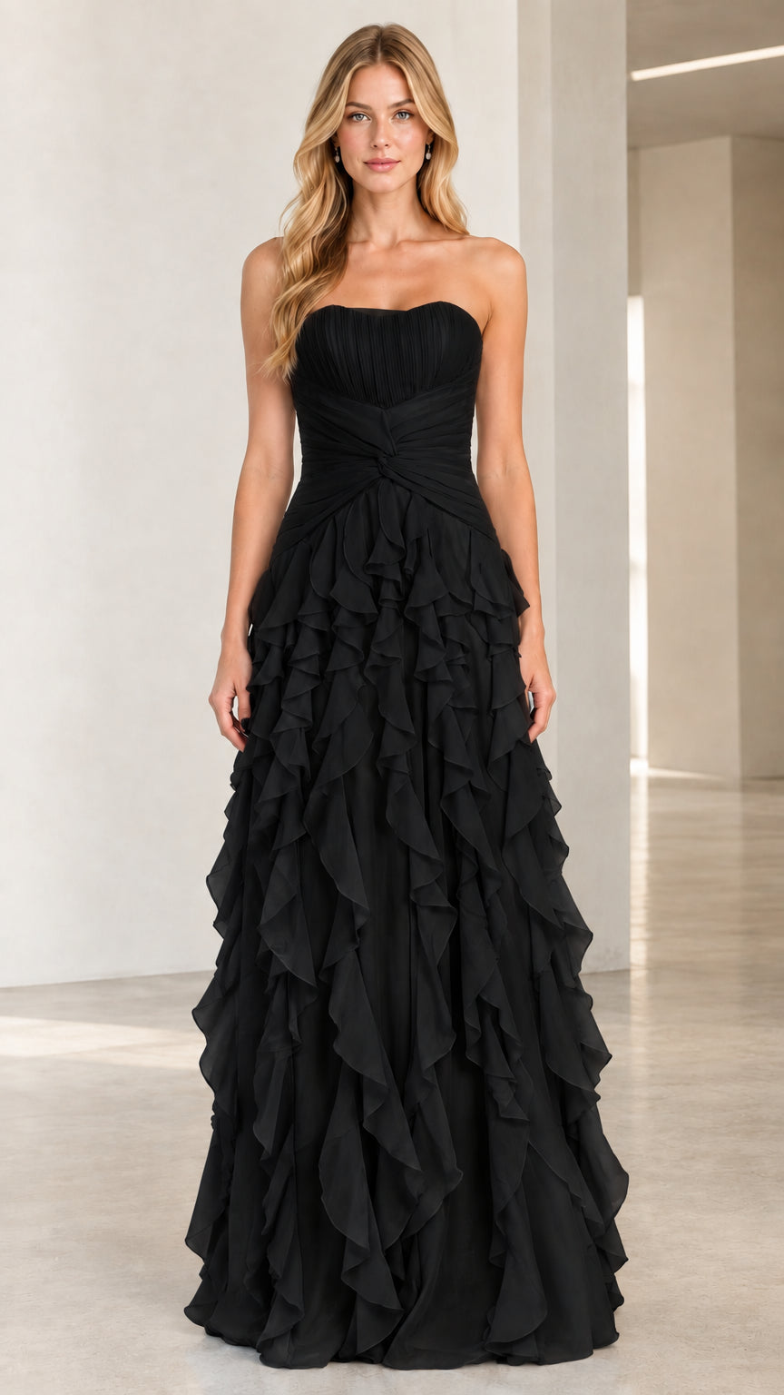Full-length front view of classic black strapless tiered ruffle evening gown