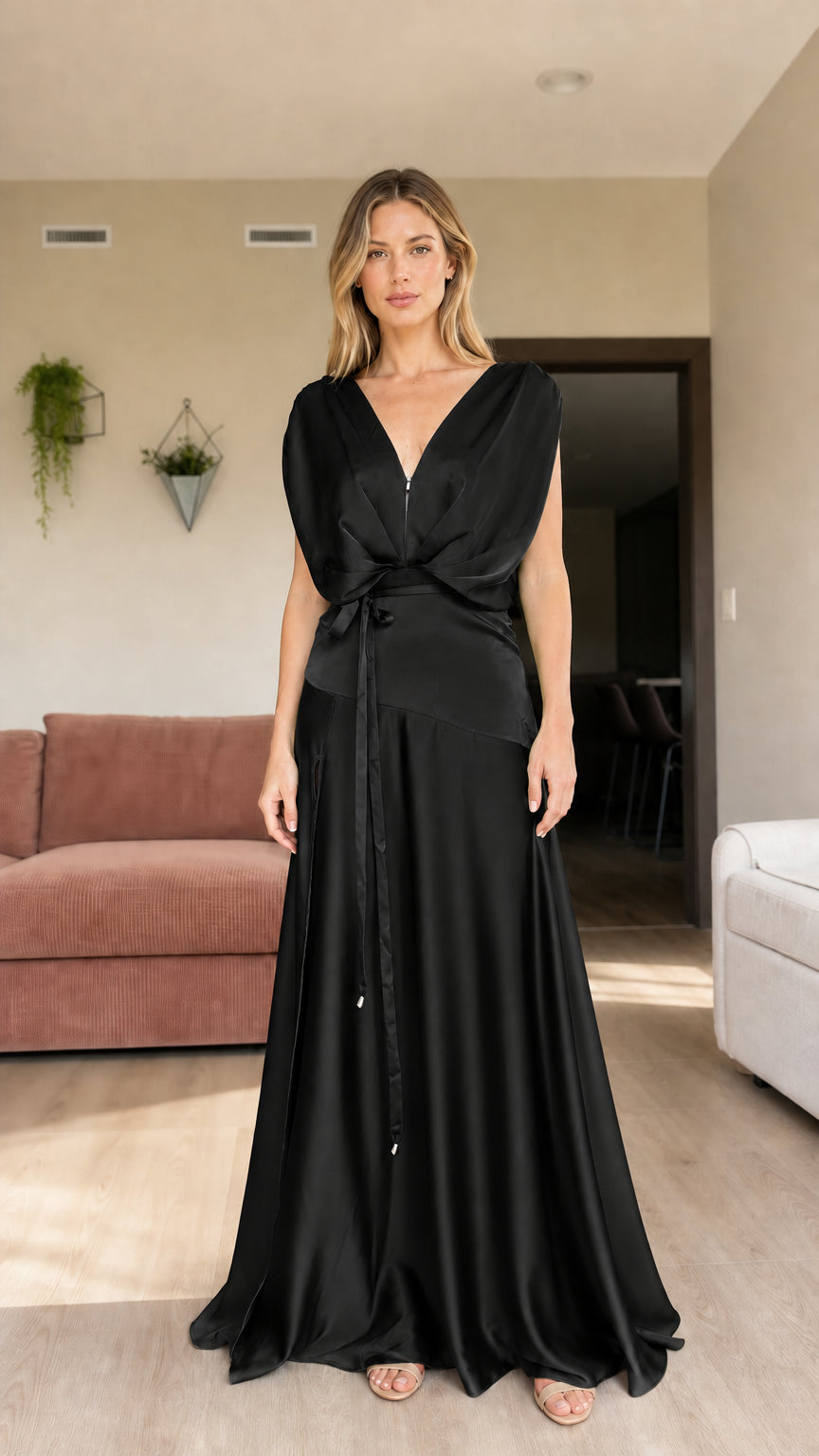 Front view of woman wearing black draped satin sleeveless evening maxi dress