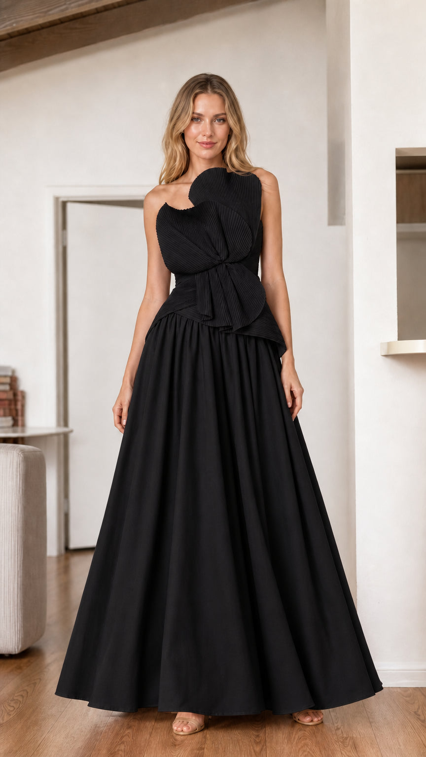 Black strapless A-line evening gown with pleated sculptural bodice detail